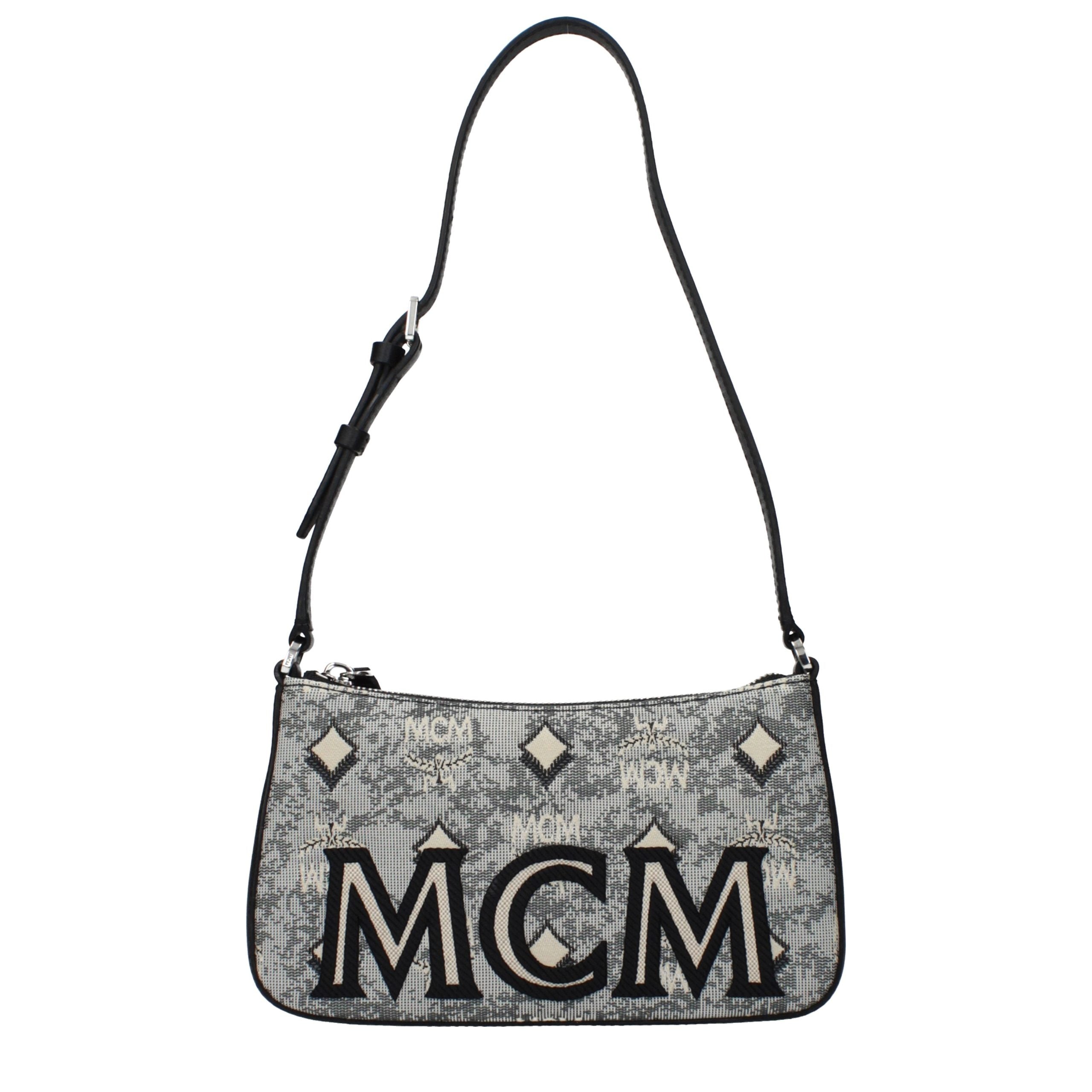 Discover the MCM Gray Fabric Crossbody Bag, a luxurious blend of sophistication and practicality, embodying timeless elegance for the discerning individual.