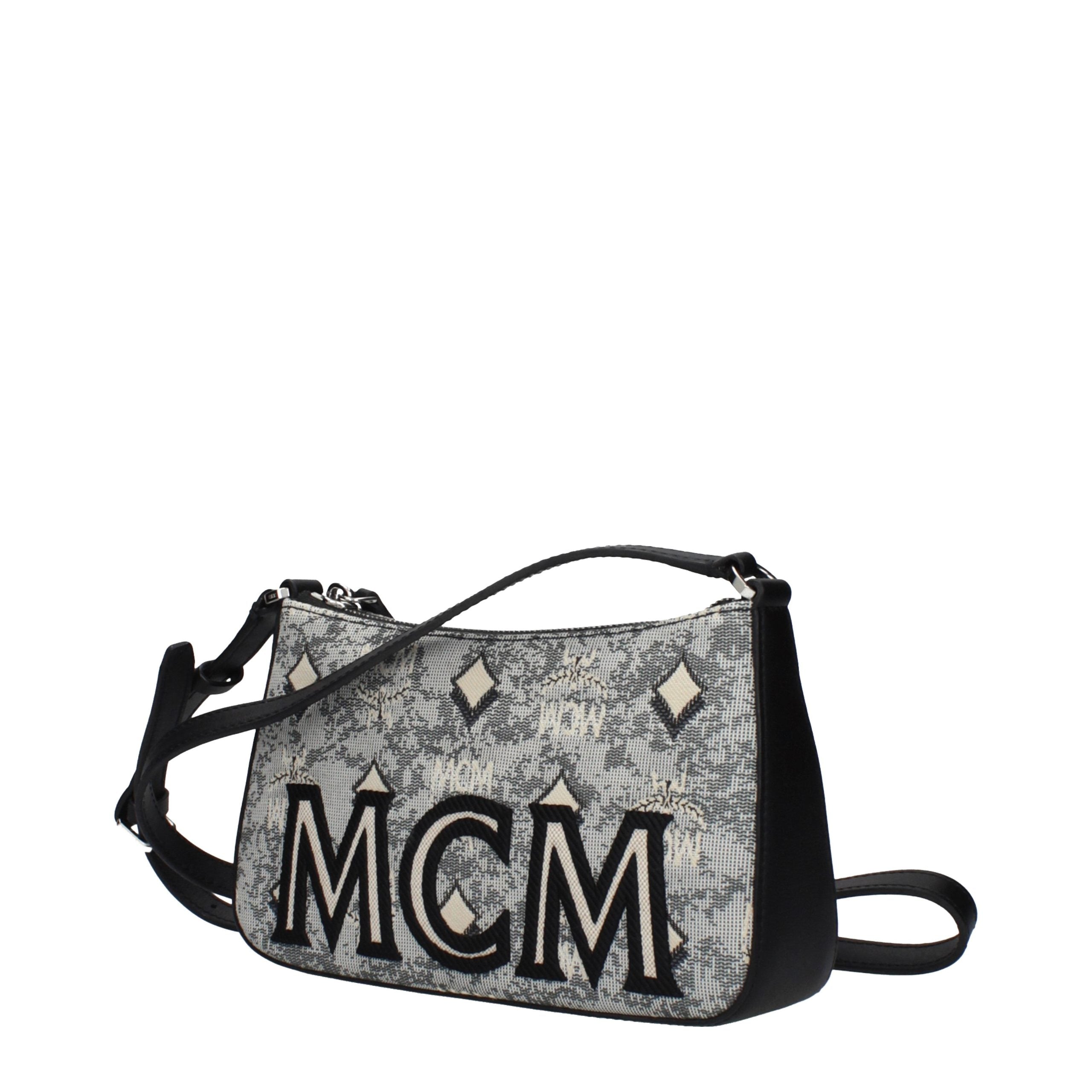 Discover the MCM Gray Fabric Crossbody Bag, a masterpiece of luxury and versatility, crafted for those who embrace elegance and sophistication in every moment.