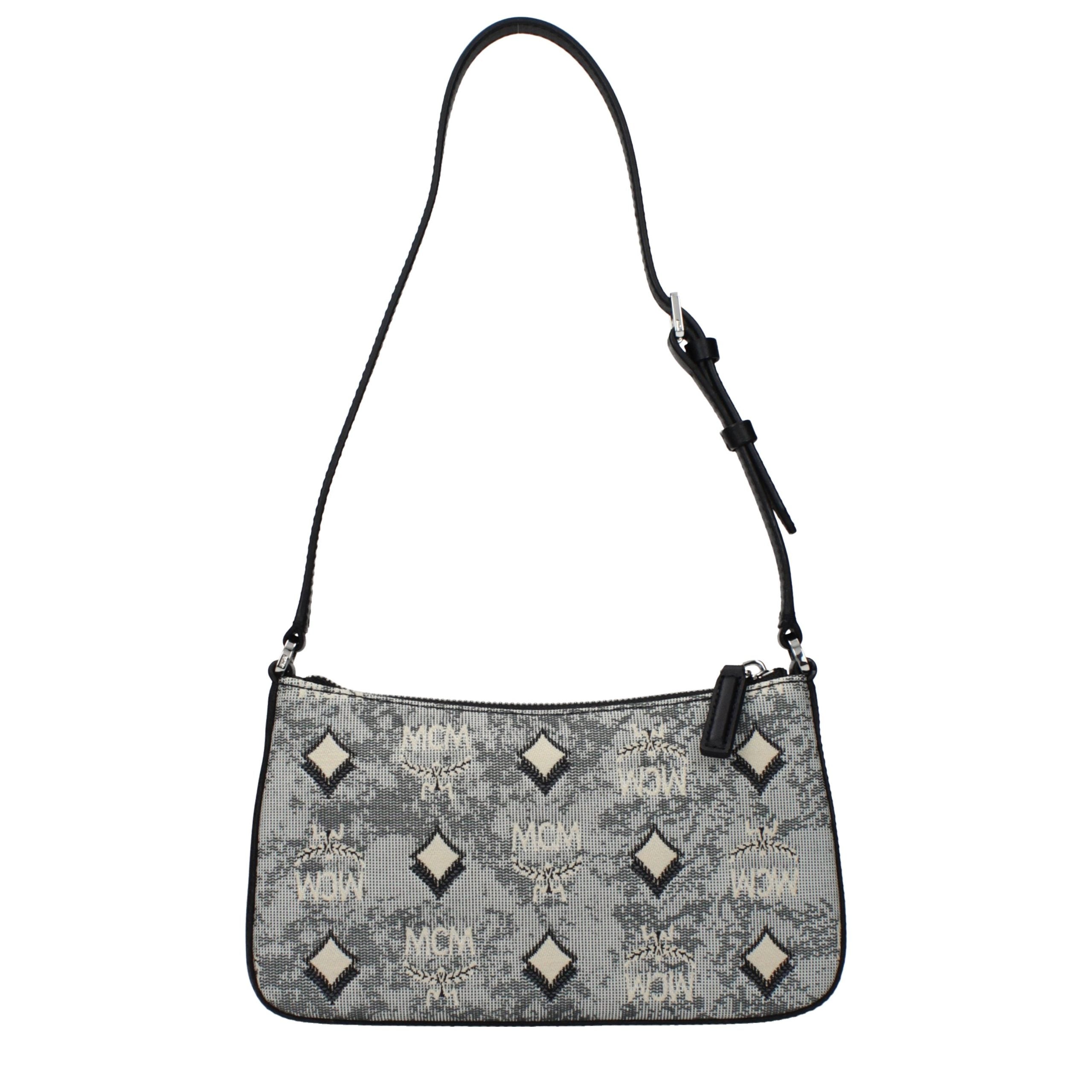 Discover the MCM Gray Fabric Crossbody Bag, a luxurious blend of sophistication and practicality, perfect for elevating your style with timeless elegance.