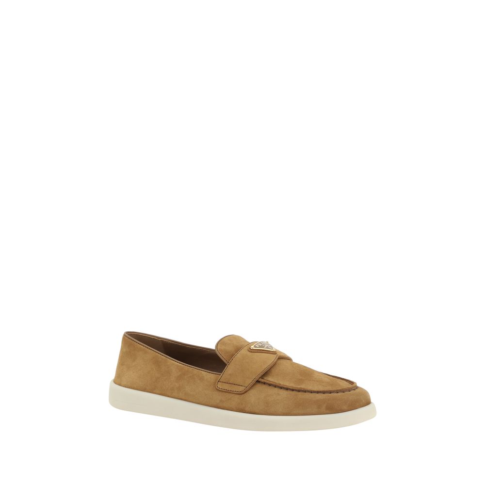 Indulge in the exquisite Prada Brown Calf Leather Bos Taurus Slip-On Loafers from the SS26 collection, where luxurious craftsmanship meets timeless elegance for the discerning individual.