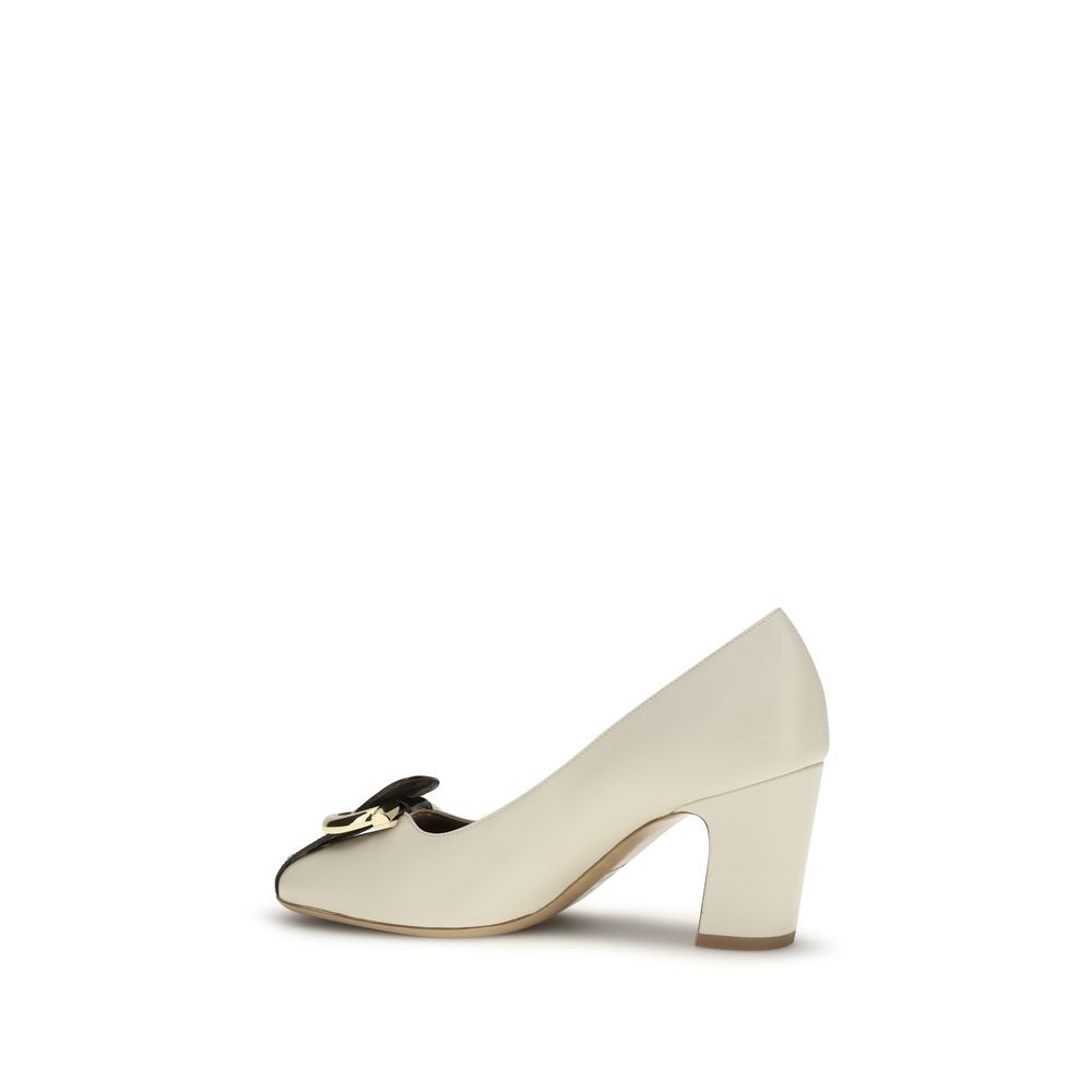 Indulge in the exquisite Ferragamo Beige Lamb Ovis Aries High Heel Pumps, where luxurious craftsmanship meets contemporary elegance, perfect for any sophisticated occasion.