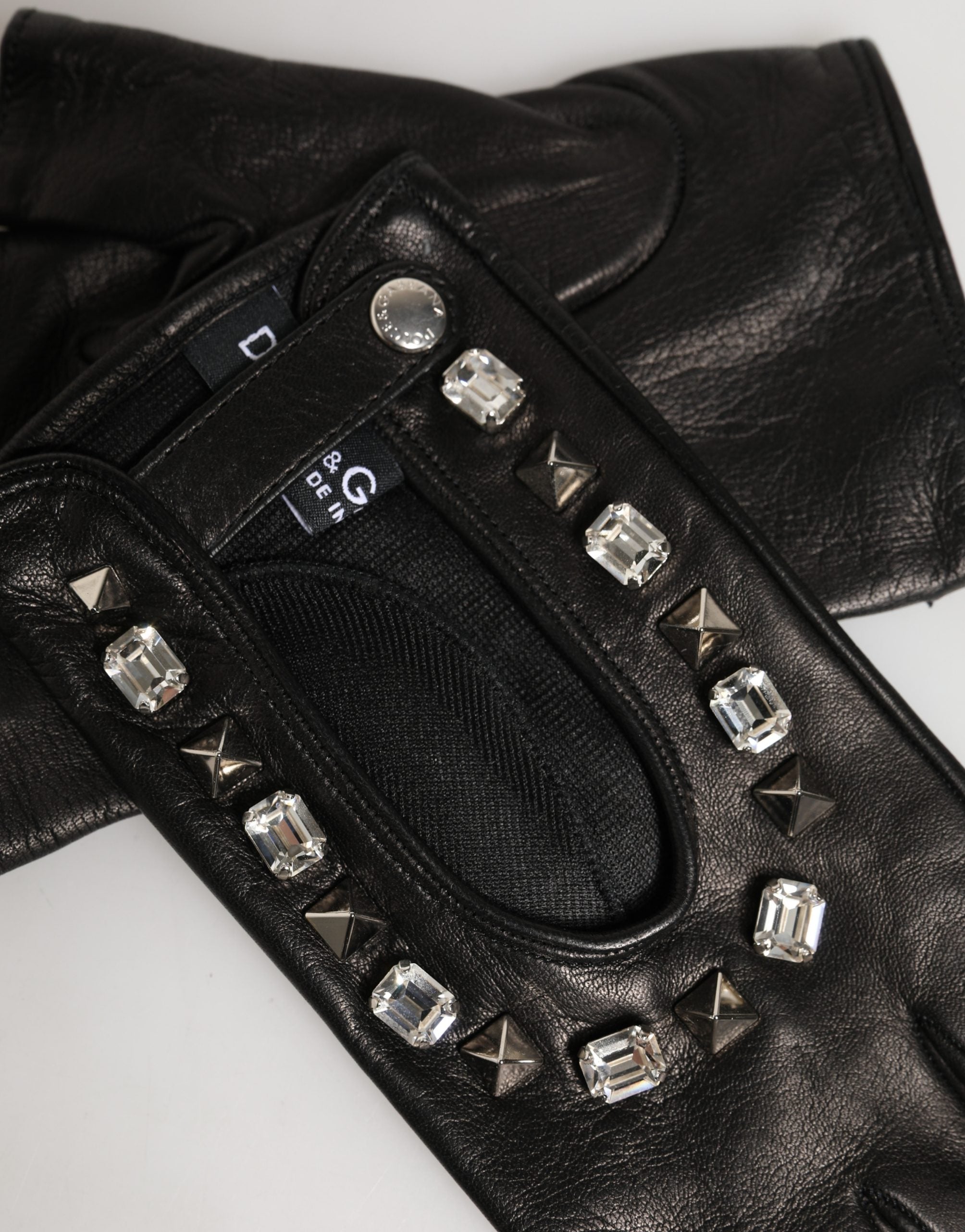 Indulge in the exquisite Dolce & Gabbana Black Embellished Mitten Gloves, crafted from premium lamb leather, merging luxurious warmth with timeless elegance for the discerning connoisseur.