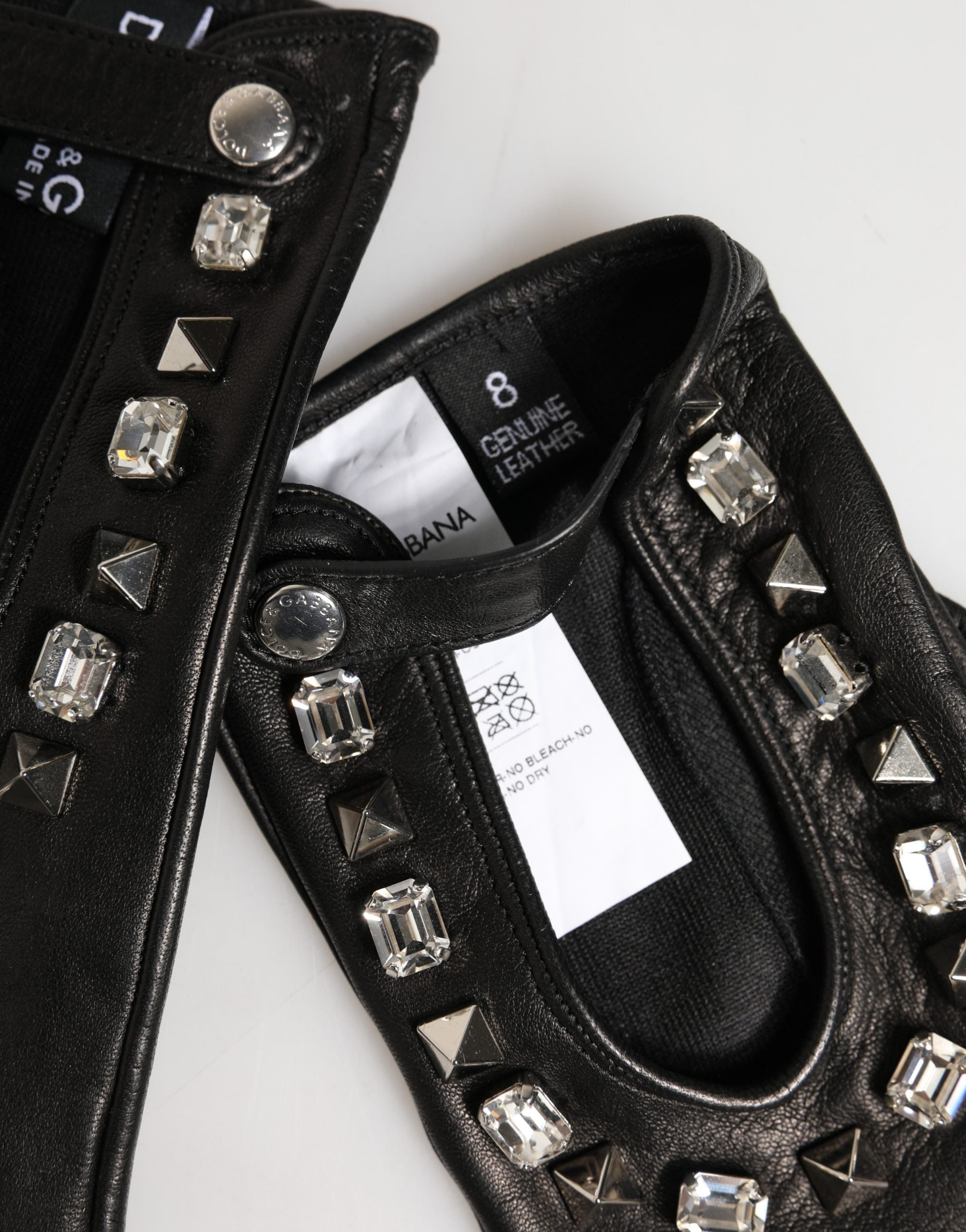 Indulge in the exquisite Dolce & Gabbana Black Embellished Mitten Gloves, crafted from premium lamb leather, merging warmth with chic elegance for the discerning connoisseur.