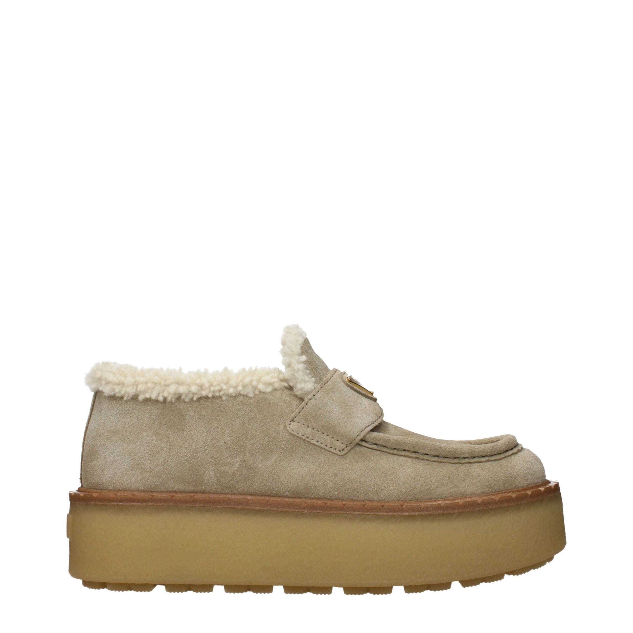 Experience the exquisite allure of Prada Beige Leather Platform Loafers, where sumptuous suede meets unparalleled craftsmanship for timeless sophistication.