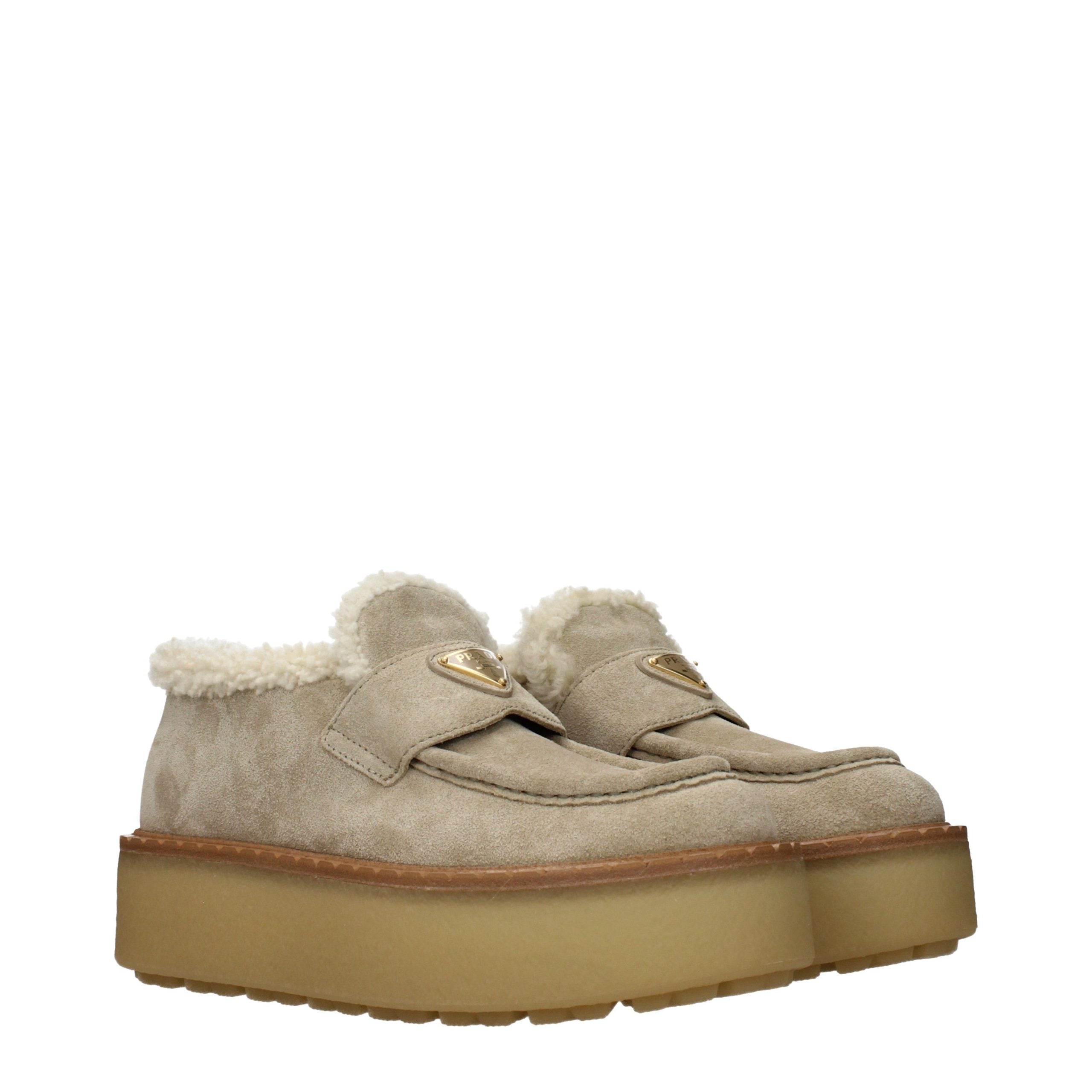Elevate your elegance with Prada Beige Leather Platform Loafers, crafted from sumptuous suede, blending luxury and comfort for the discerning individual.