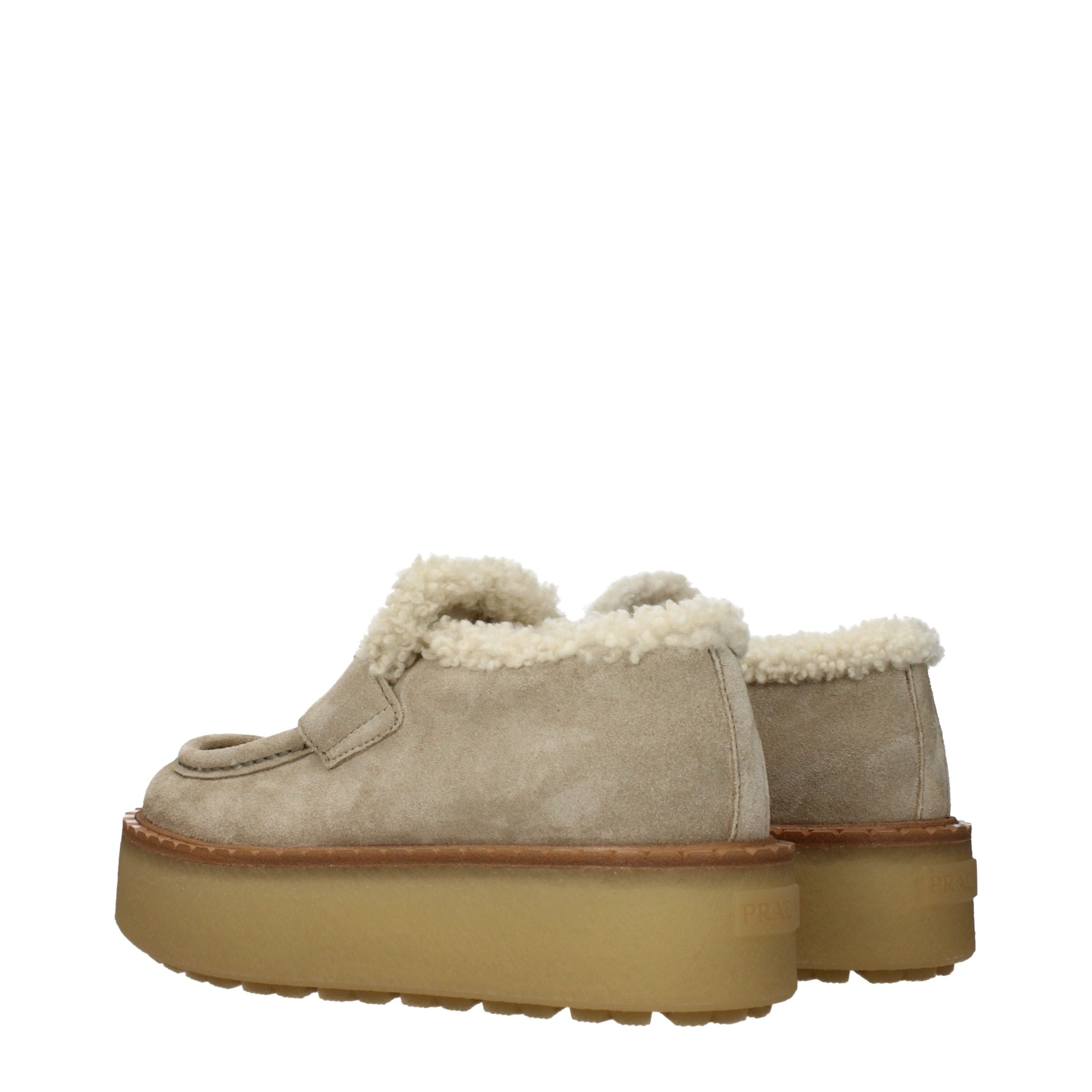 Experience unparalleled luxury with Prada Beige Leather Platform Loafers, where sumptuous suede and exquisite craftsmanship redefine sophistication for every occasion.