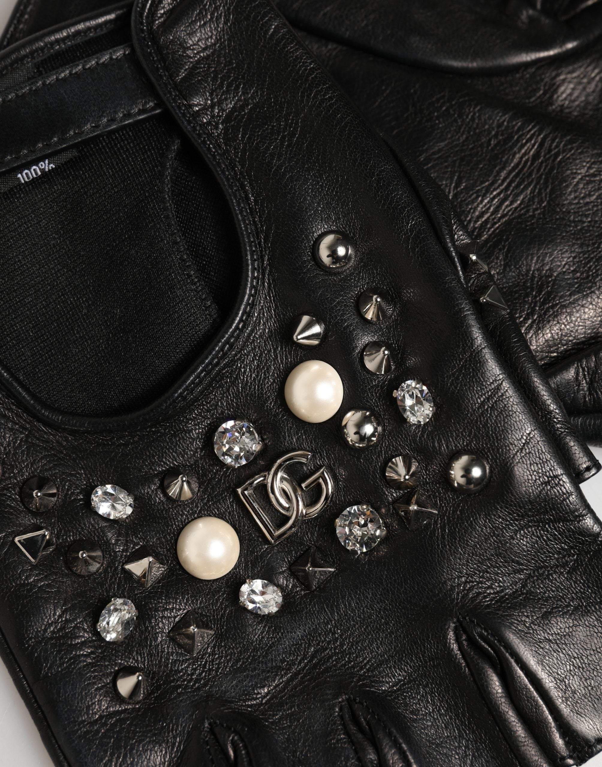 Experience the allure of Dolce & Gabbana's Black Embellished Mitten Gloves, crafted from 100% genuine leather, merging exquisite Italian craftsmanship with luxurious style.