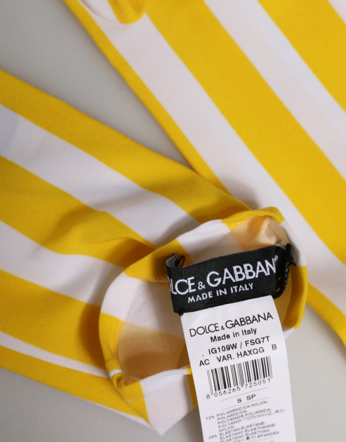 Elevate your elegance with Dolce & Gabbana's Yellow White Stripes Elbow Length Gloves, a luxurious blend of nylon and elastane, crafted in Italy for the discerning fashion connoisseur.