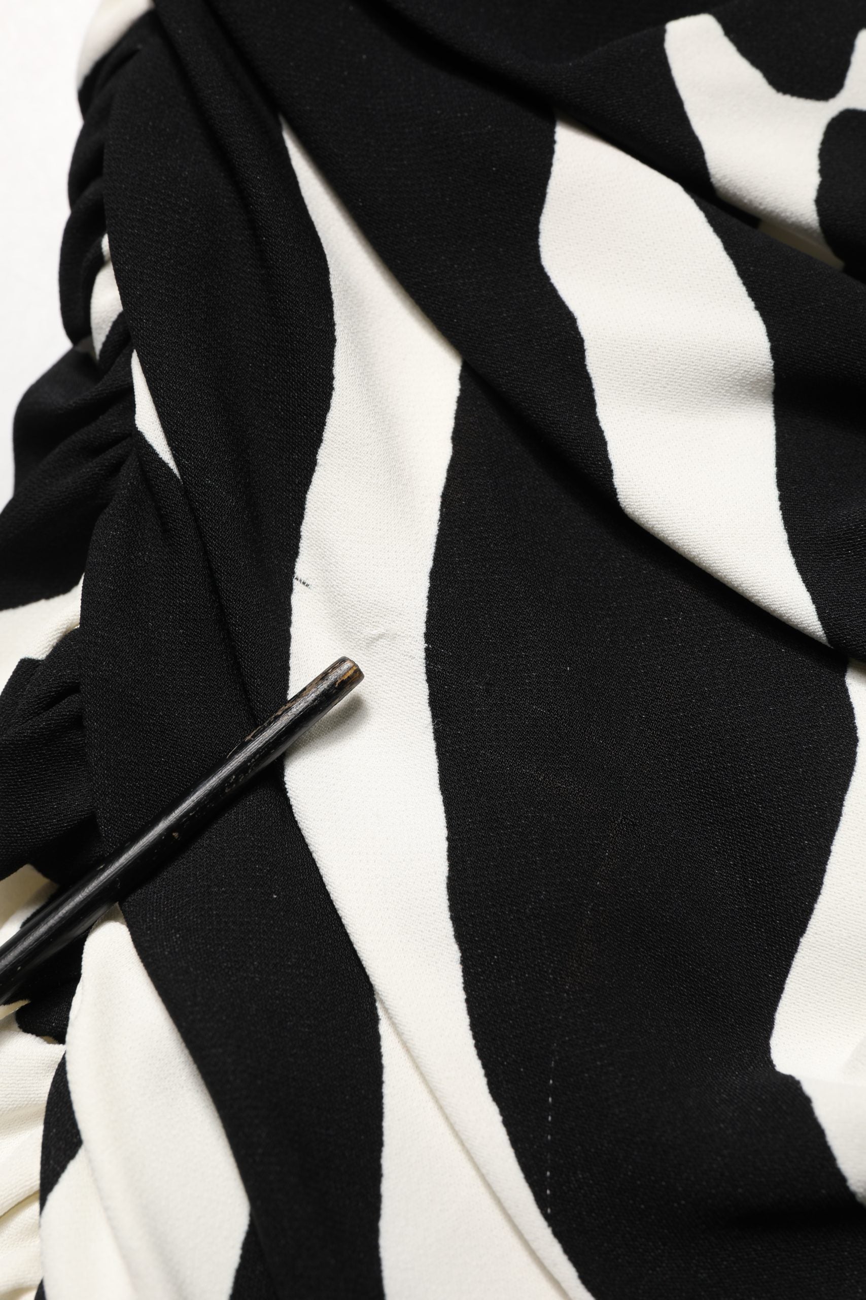 Indulge in the exquisite allure of Dolce & Gabbana's zebra print cady dress, a masterpiece of Italian craftsmanship that embodies timeless elegance for any occasion.