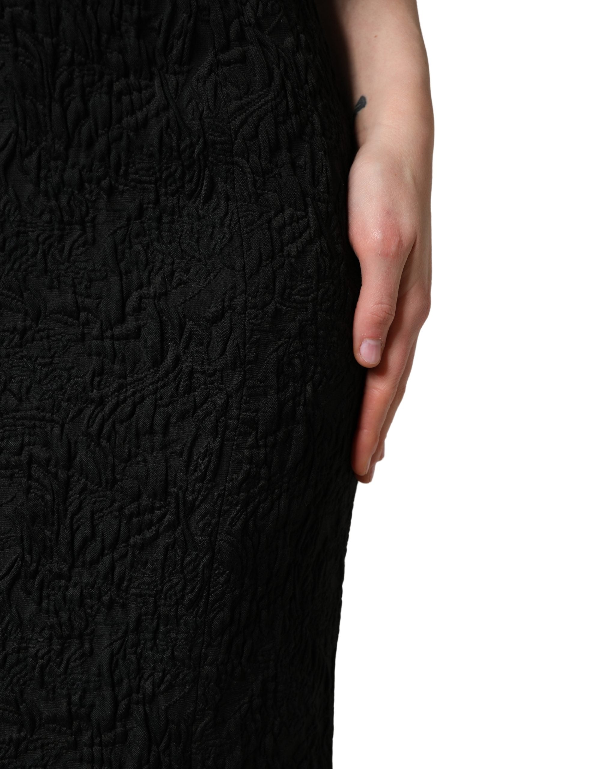 Indulge in the elegance of the Dolce & Gabbana Black Floral Brocade Sheath Mermaid Dress, a masterpiece of Italian craftsmanship that redefines luxury and allure.