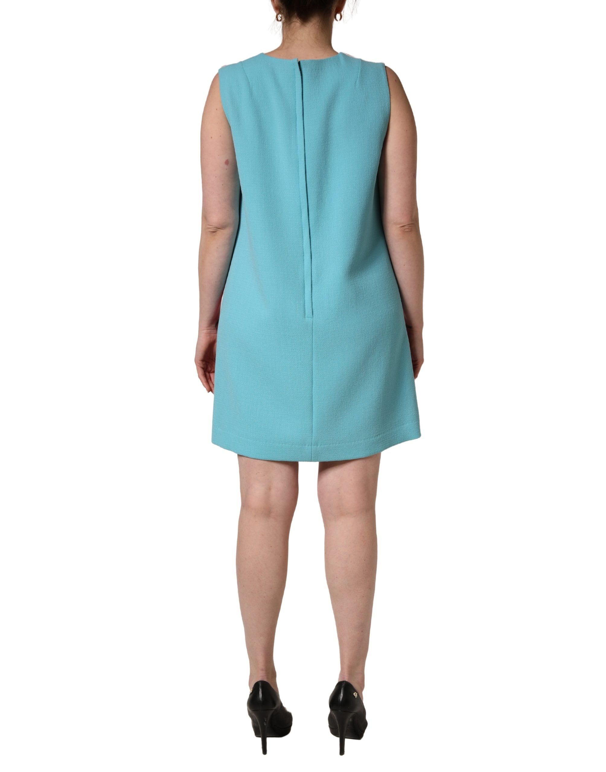 Indulge in the exquisite Dolce & Gabbana Pink Blue Wool Sleeveless Shift Mini Dress, a timeless blend of luxurious virgin wool and silk, embodying sophisticated elegance for every occasion.