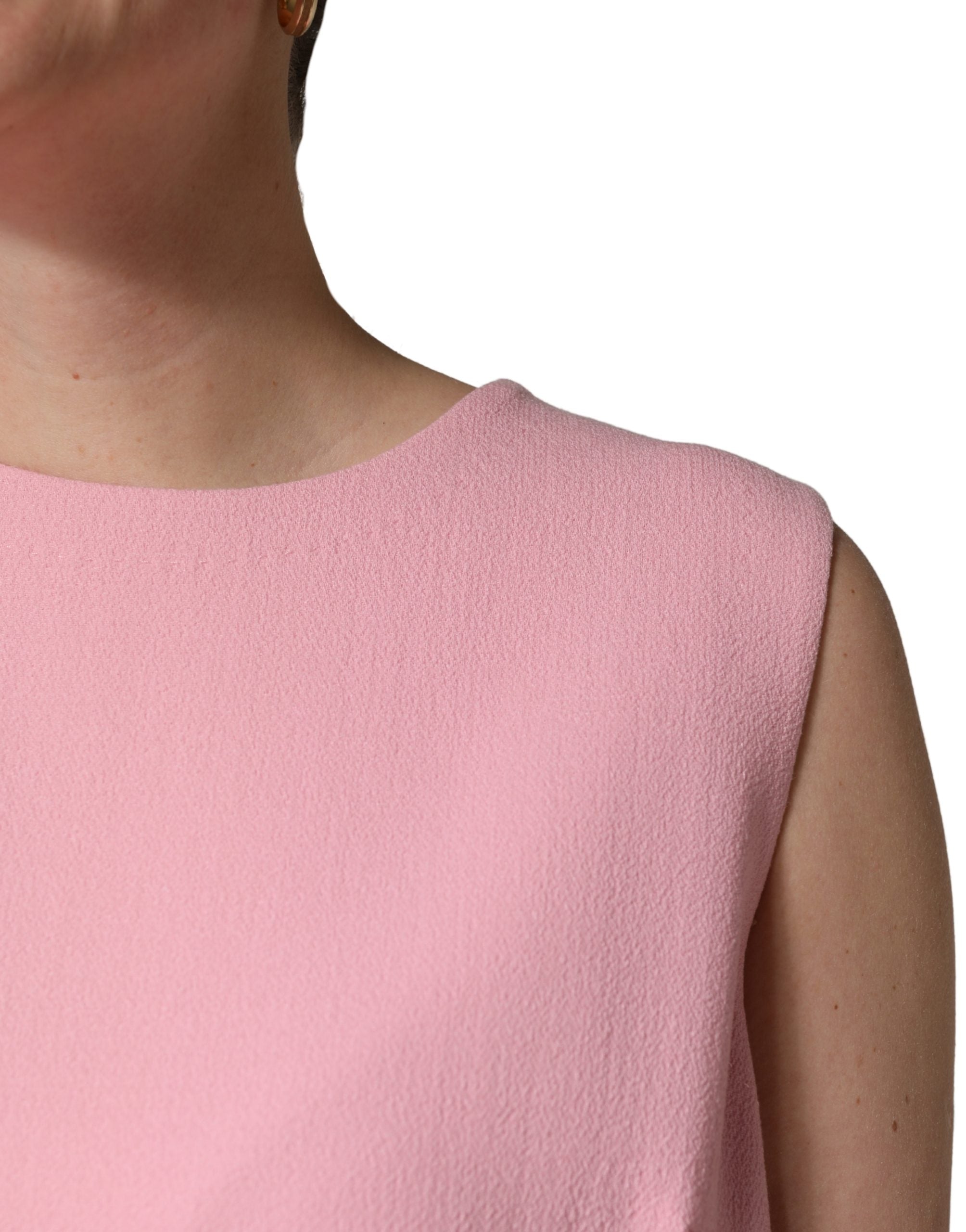 Indulge in the exquisite allure of the Dolce & Gabbana Pink Blue Wool Sleeveless Shift Mini Dress, a masterpiece of Italian craftsmanship that redefines luxury and sophistication.