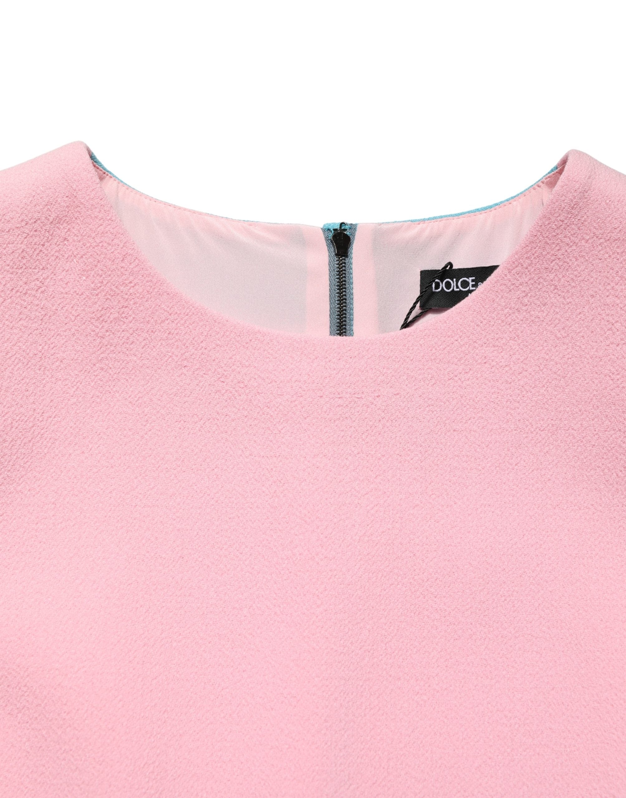 Indulge in the exquisite Dolce & Gabbana Pink Blue Wool Sleeveless Shift Mini Dress, where luxurious virgin wool meets Italian craftsmanship for a timeless statement of elegance.