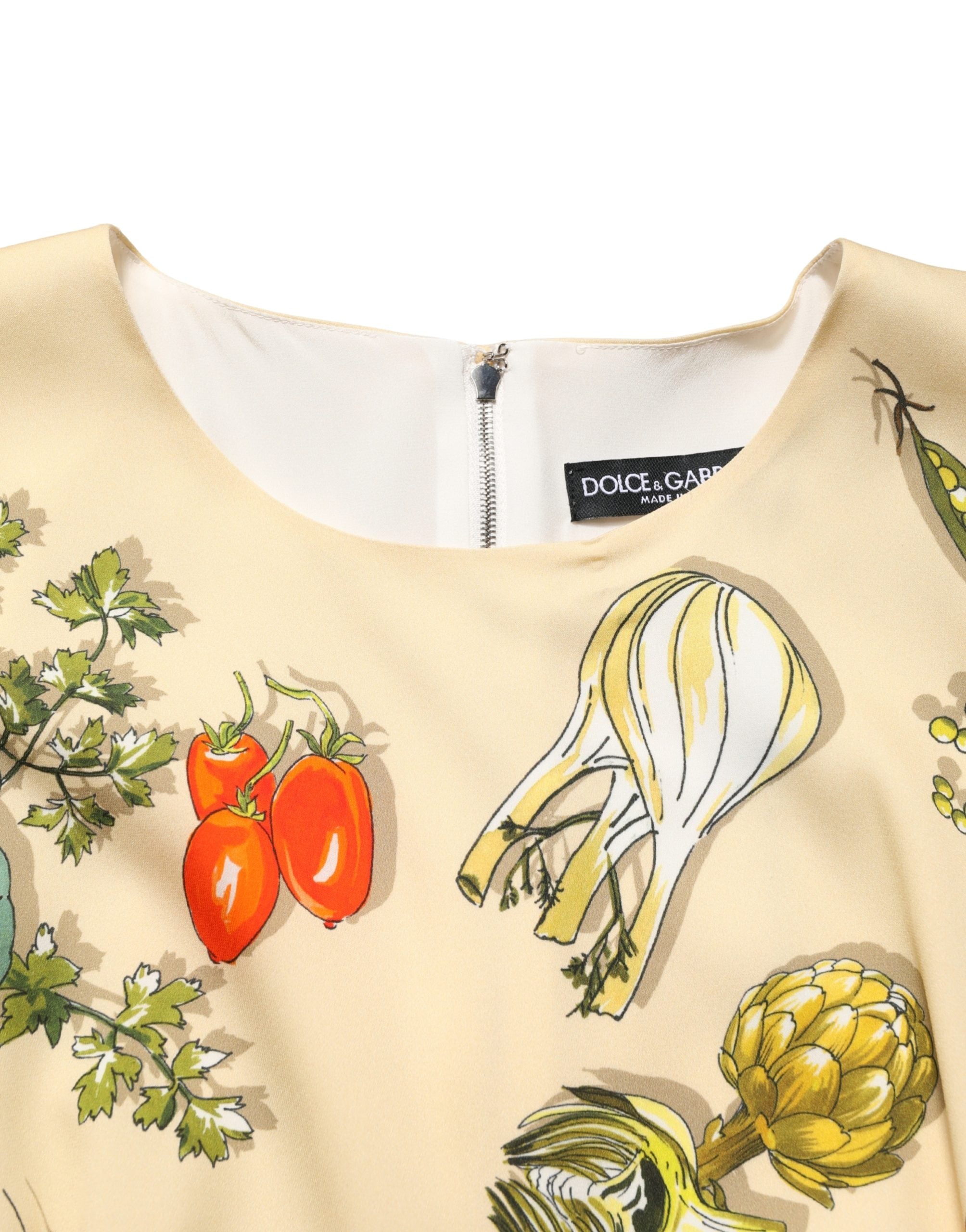 Indulge in the exquisite Dolce & Gabbana Beige Fruit PolkaDot Sheath Silk Midi Dress, a luxurious blend of silk and elastane, embodying Italian craftsmanship and timeless elegance.