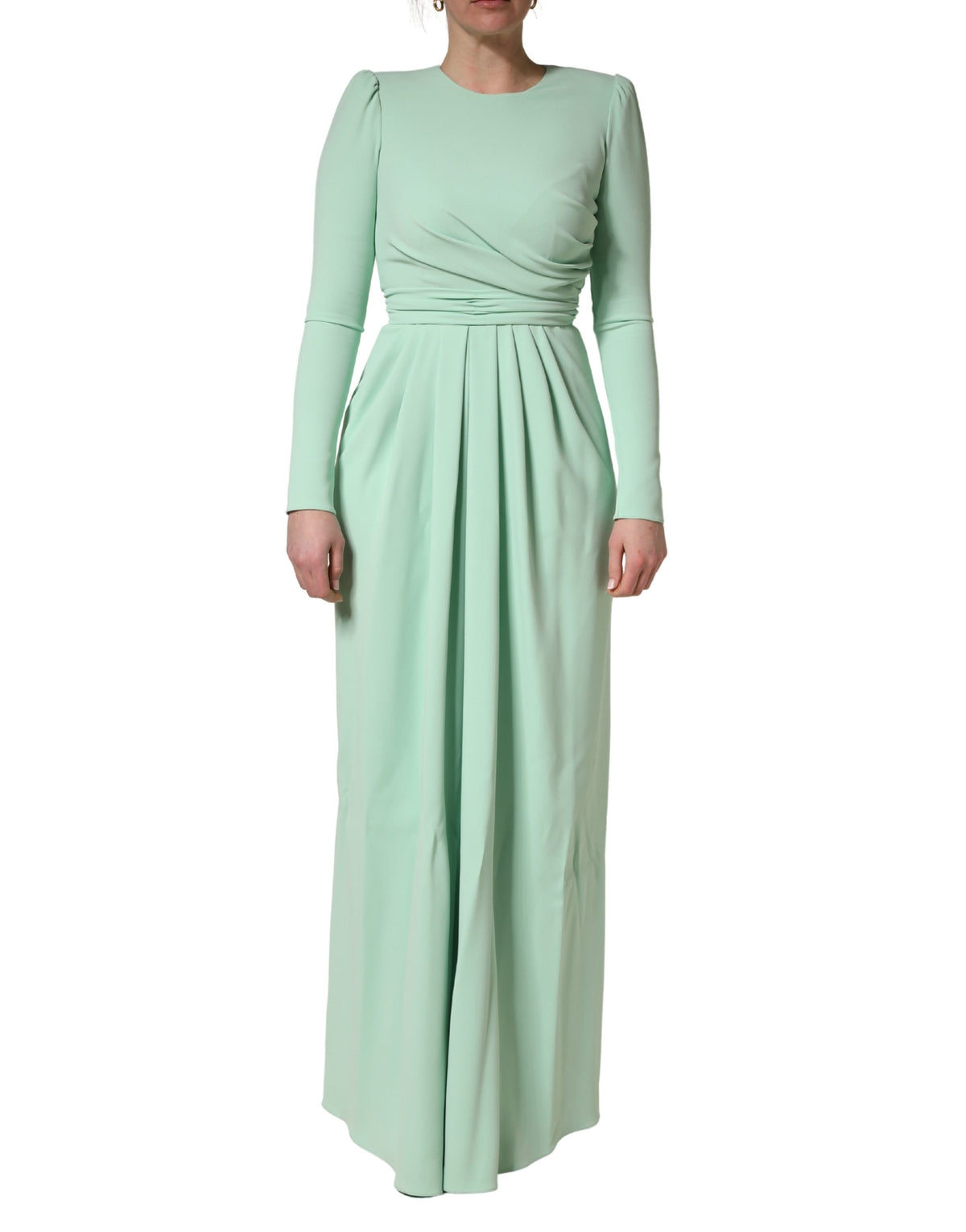 Indulge in the exquisite allure of the Dolce & Gabbana Green Viscose Long Sleeves Gown, a masterpiece of Italian craftsmanship that embodies timeless elegance and sophistication.