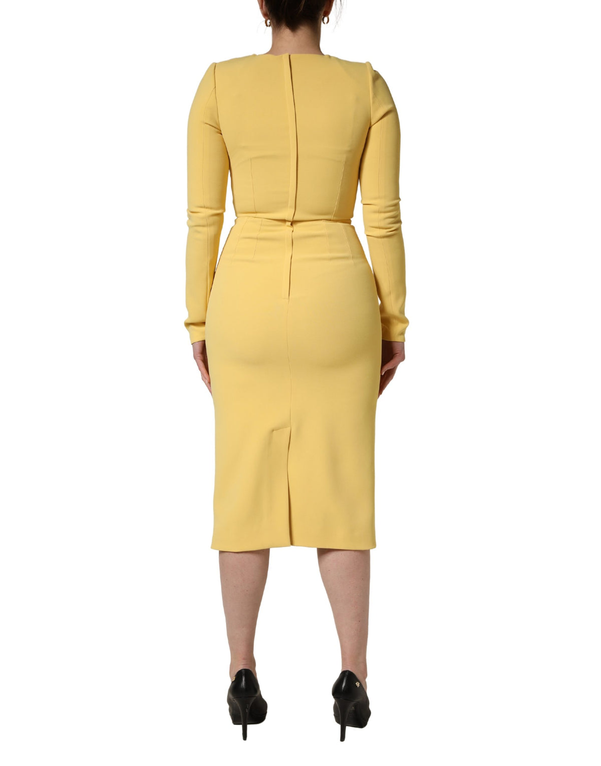 Experience the allure of the Dolce & Gabbana Yellow Silk Long Sleeves Sheath Midi Dress, a masterpiece of Italian craftsmanship that embodies timeless elegance and sophistication for any upscale occasion.