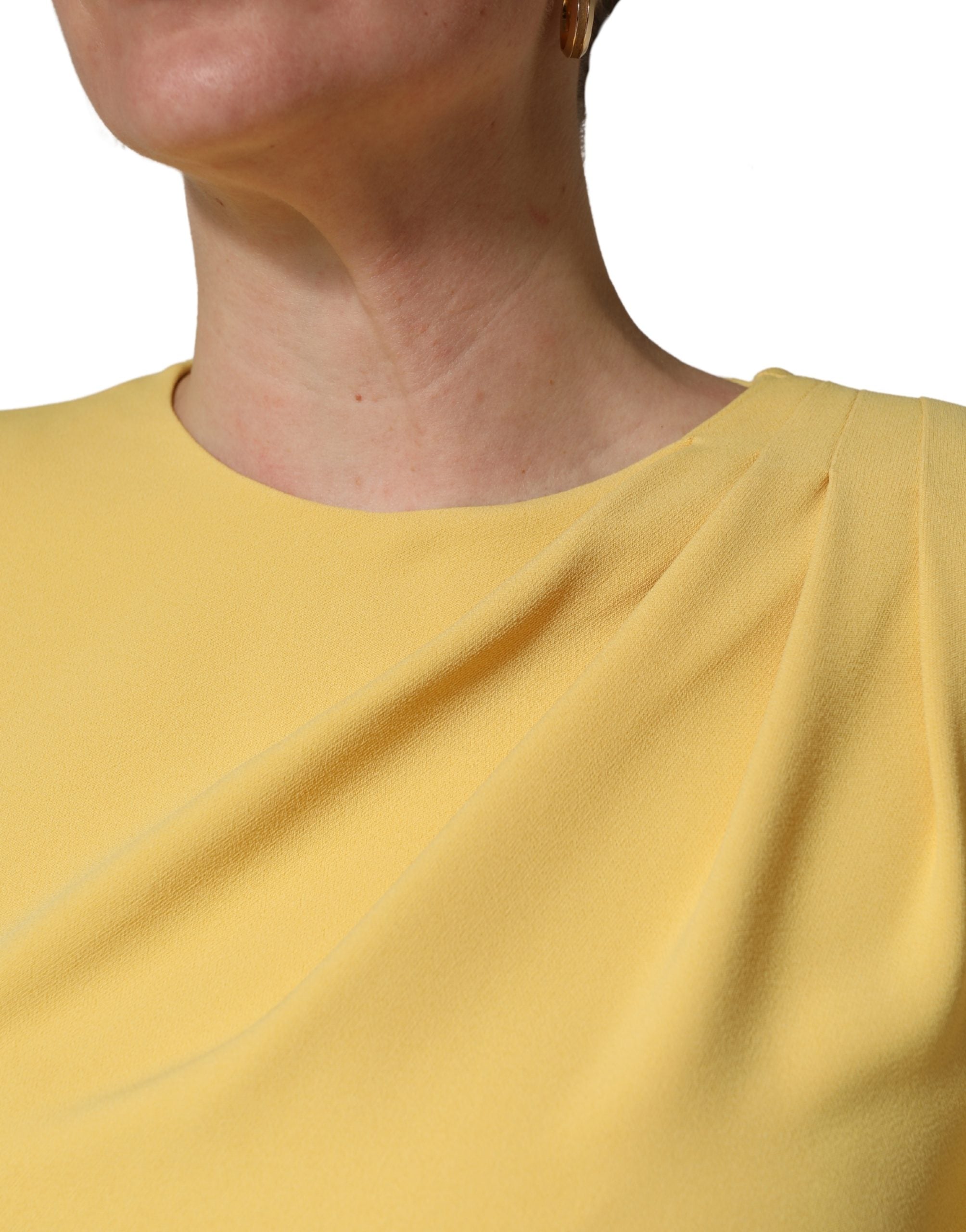 Experience the exquisite allure of the Dolce & Gabbana Yellow Silk Long Sleeves Sheath Midi Dress, a testament to Italian craftsmanship and timeless elegance for discerning tastes.