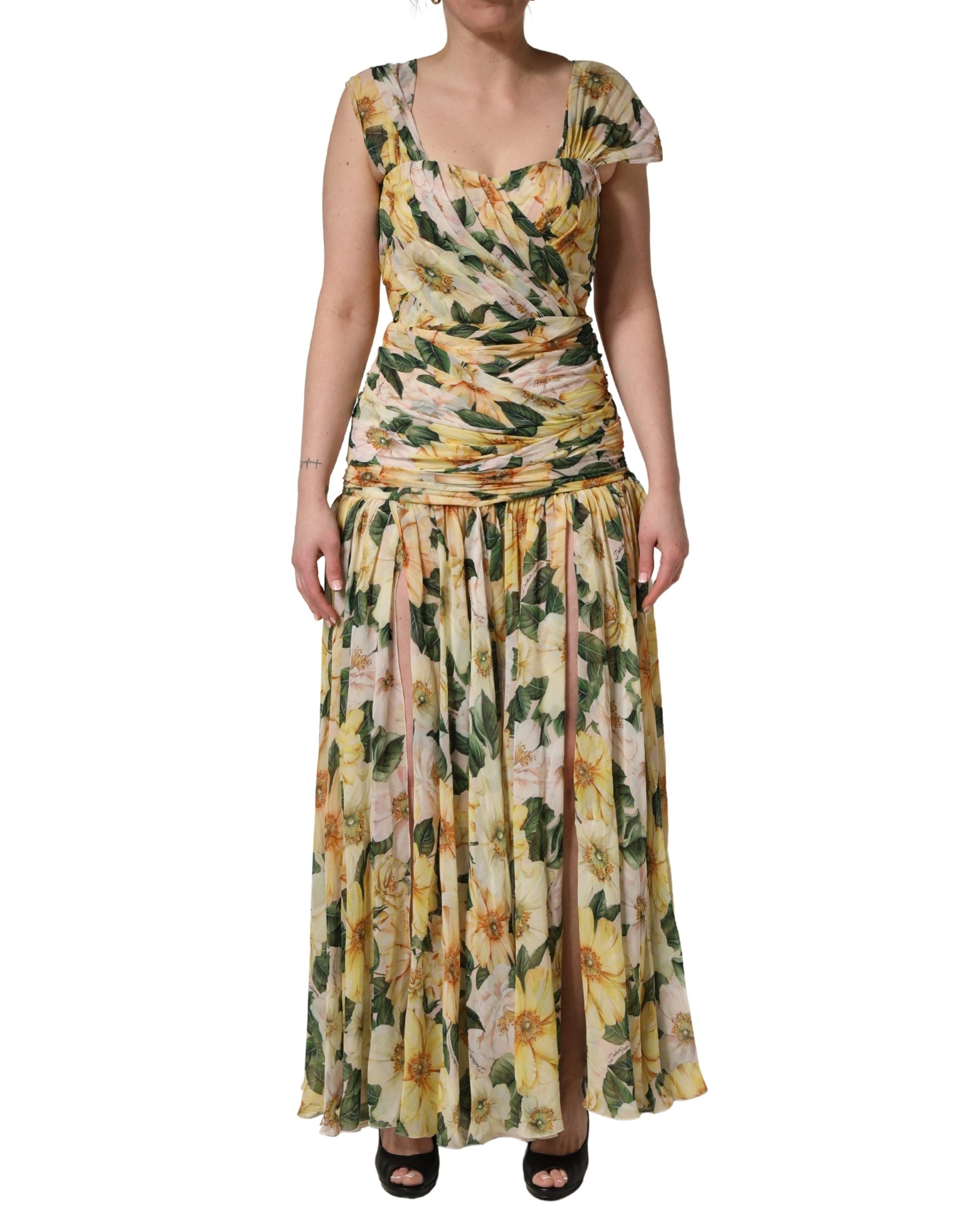 Indulge in the exquisite allure of the Dolce & Gabbana Yellow Silk Floral Print Pleated Maxi Dress, a testament to Italian craftsmanship that elevates every occasion with luxurious elegance.
