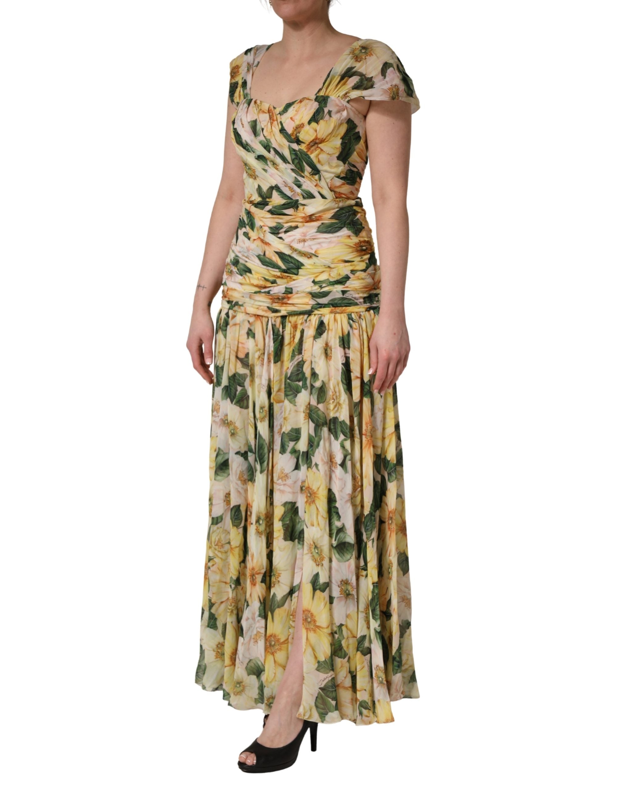 Indulge in the exquisite allure of the Dolce & Gabbana Yellow Silk Floral Print Pleated Maxi Dress, a masterpiece of Italian craftsmanship that embodies luxury and elegance for every occasion.