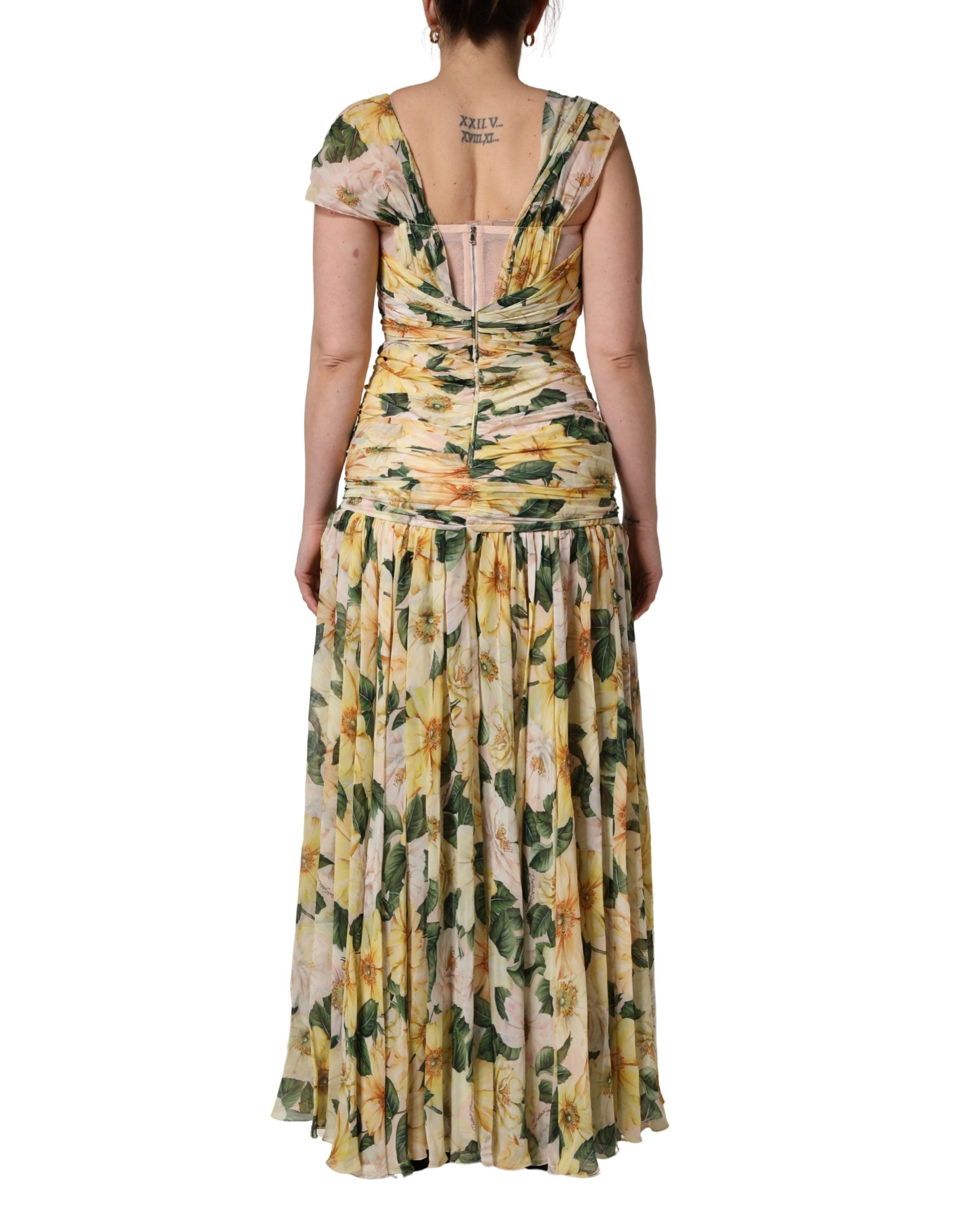 Indulge in the exquisite allure of the Dolce & Gabbana Yellow Silk Floral Print Pleated Maxi Dress, a masterpiece of Italian craftsmanship that elevates every occasion with luxurious elegance.
