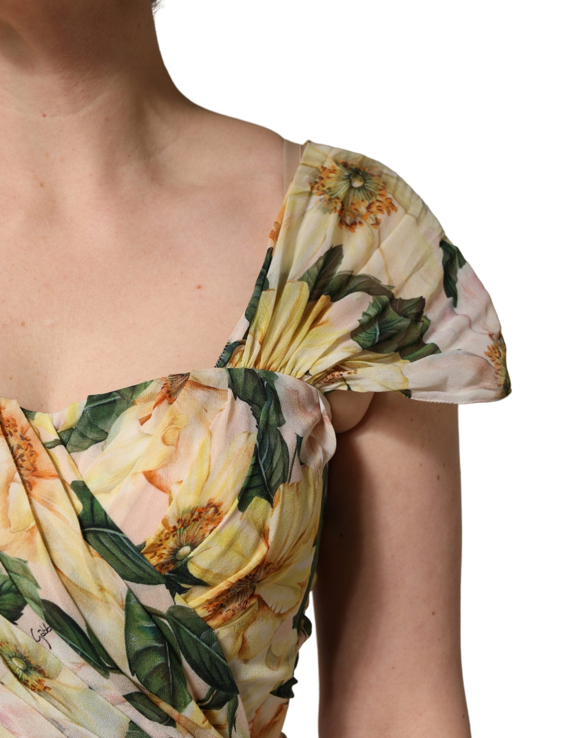 Elevate your wardrobe with the Dolce & Gabbana Yellow Silk Floral Print Pleated Maxi Dress, a masterpiece of Italian craftsmanship that embodies luxury and sophistication.