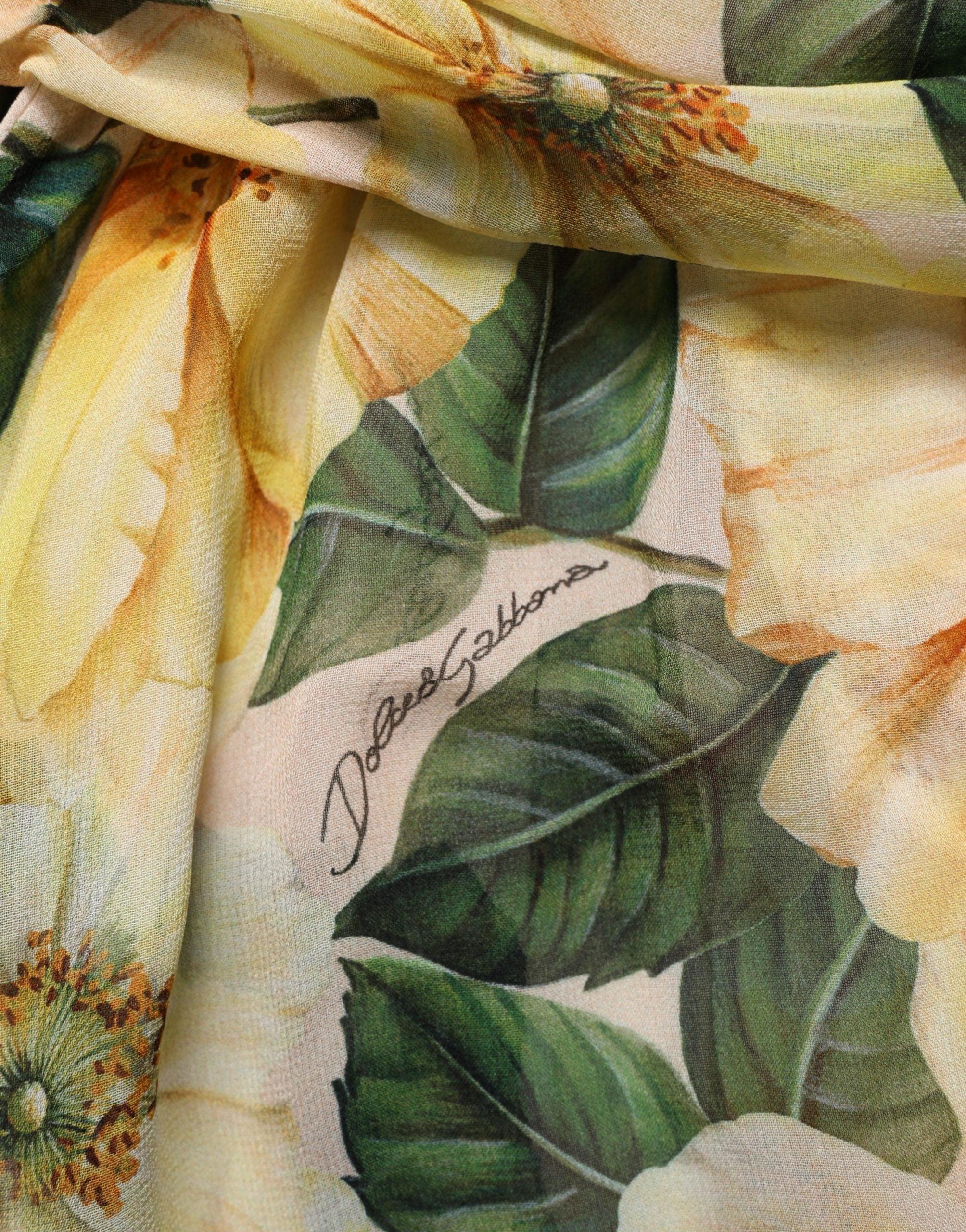 Elevate your wardrobe with the Dolce & Gabbana Yellow Silk Floral Print Pleated Maxi Dress, a masterpiece of Italian craftsmanship that embodies timeless elegance and allure.