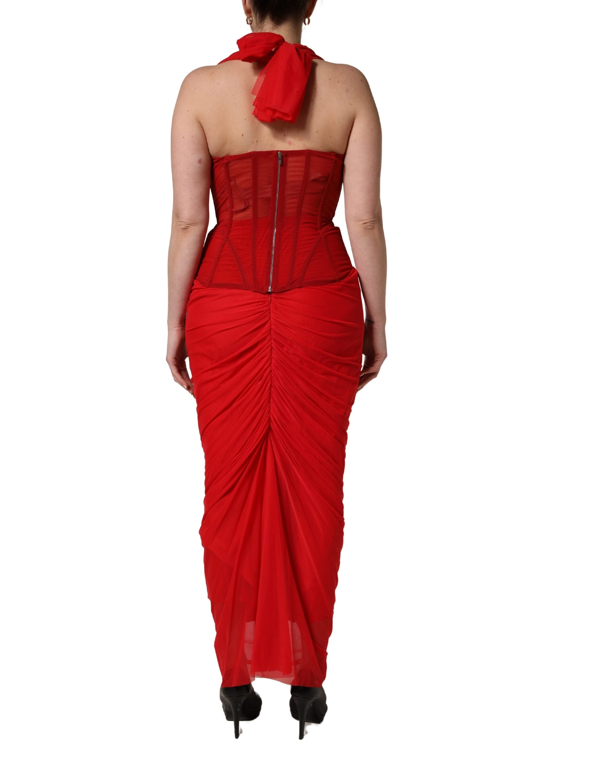 Indulge in the exquisite allure of the Dolce & Gabbana Red Halter Corset Sheath Dress, a masterpiece of Italian craftsmanship that embodies luxury and sophistication.