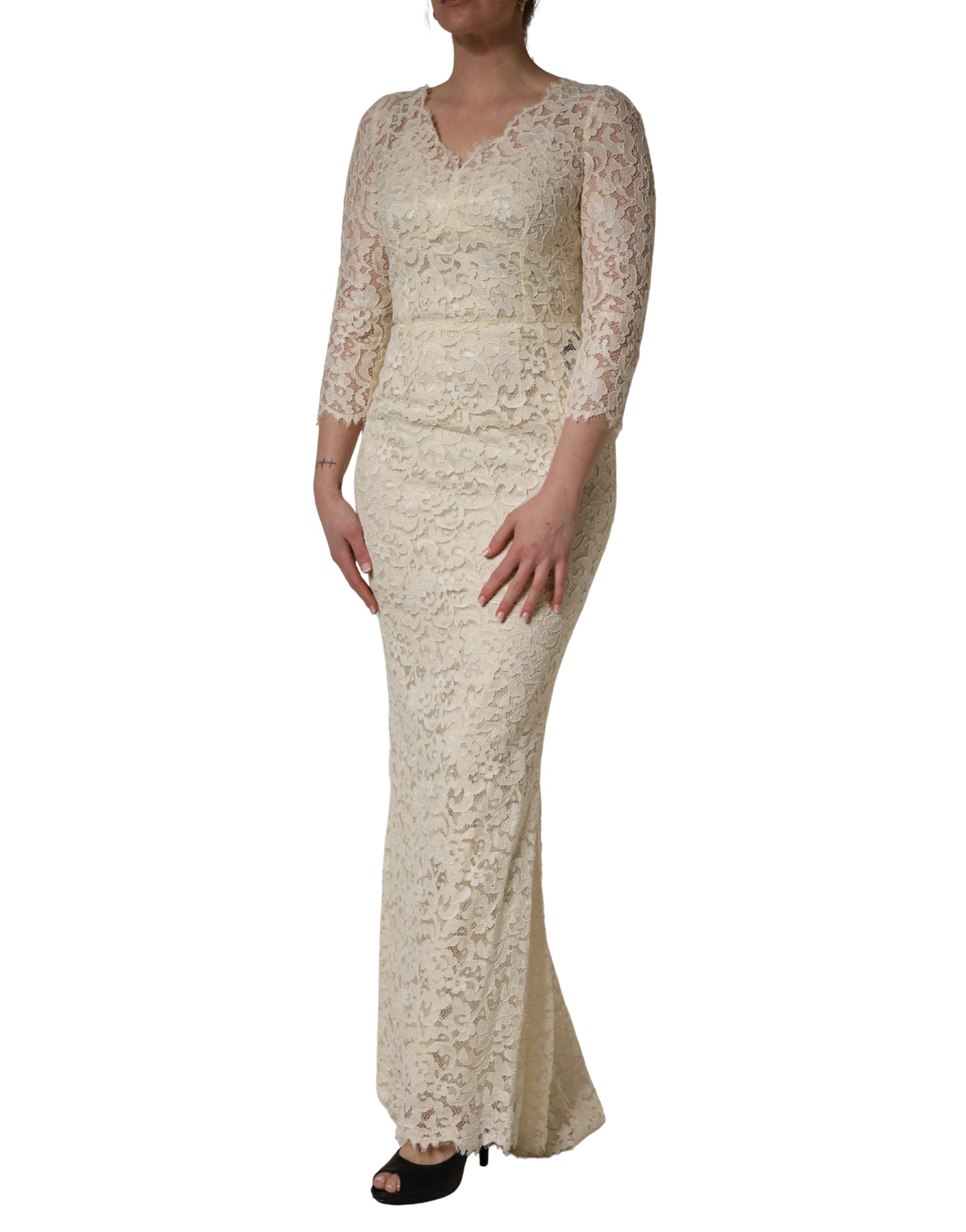 Indulge in the exquisite allure of the Dolce & Gabbana Off White Floral Lace Sheath Maxi Dress, a timeless masterpiece of Italian craftsmanship that elevates any occasion.
