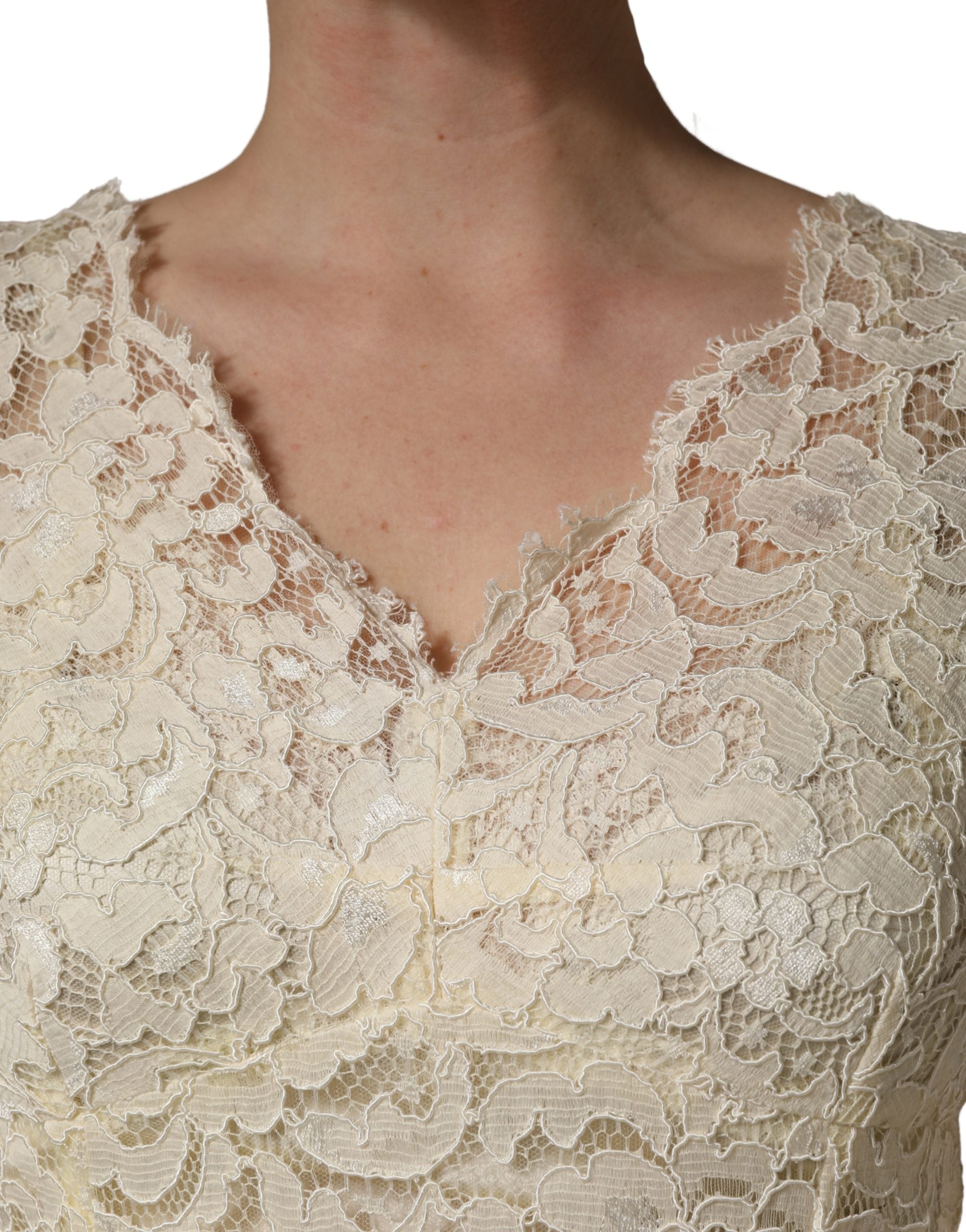 Indulge in the exquisite allure of the Dolce & Gabbana Off White Floral Lace Sheath Maxi Dress, a testament to Italian craftsmanship that elevates any occasion with timeless elegance.