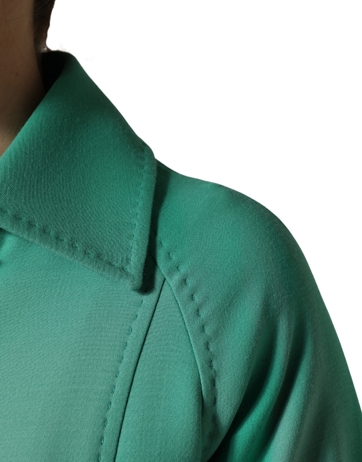 Elevate your style with the Dolce & Gabbana Green Buttoned Down Belt Trench Coat, crafted from 100% virgin wool, embodying timeless elegance and exquisite Italian craftsmanship.
