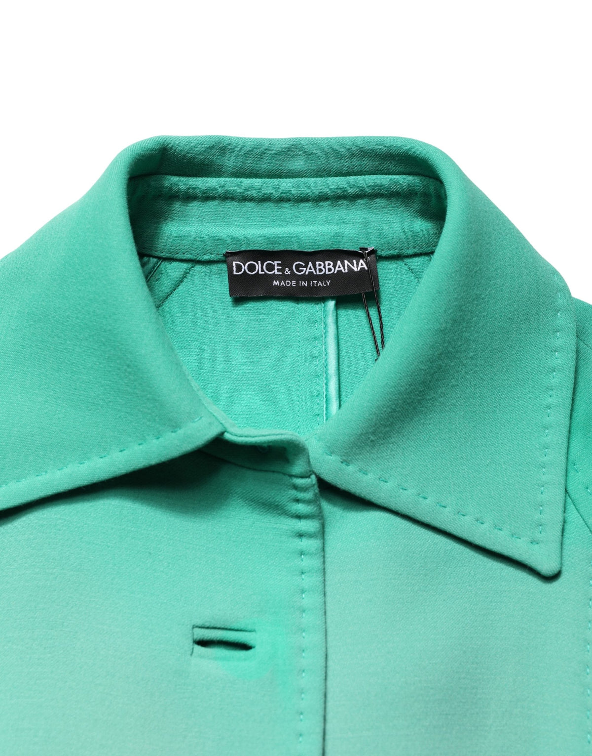 Elevate your wardrobe with the Dolce & Gabbana Green Buttoned Down Belt Trench Coat, a masterpiece in 100% virgin wool, embodying timeless elegance and exquisite Italian craftsmanship.