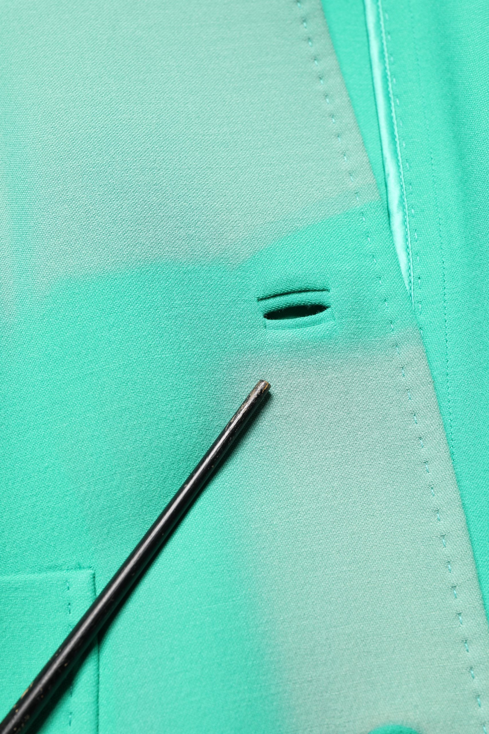 Indulge in the exquisite Dolce & Gabbana Green Buttoned Down Belt Trench Coat, crafted from 100% virgin wool, a timeless piece that embodies luxury and sophistication.