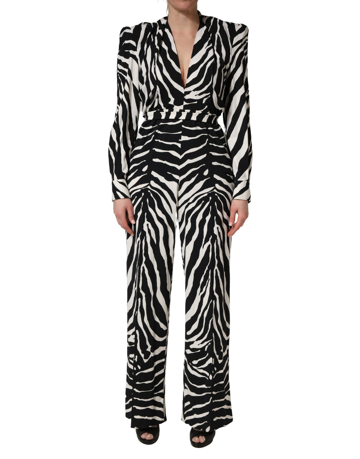 Indulge in the exquisite Dolce & Gabbana Black White Viscose Zebra Pattern Jumpsuit, where luxurious craftsmanship meets bold artistry, perfect for any sophisticated occasion.