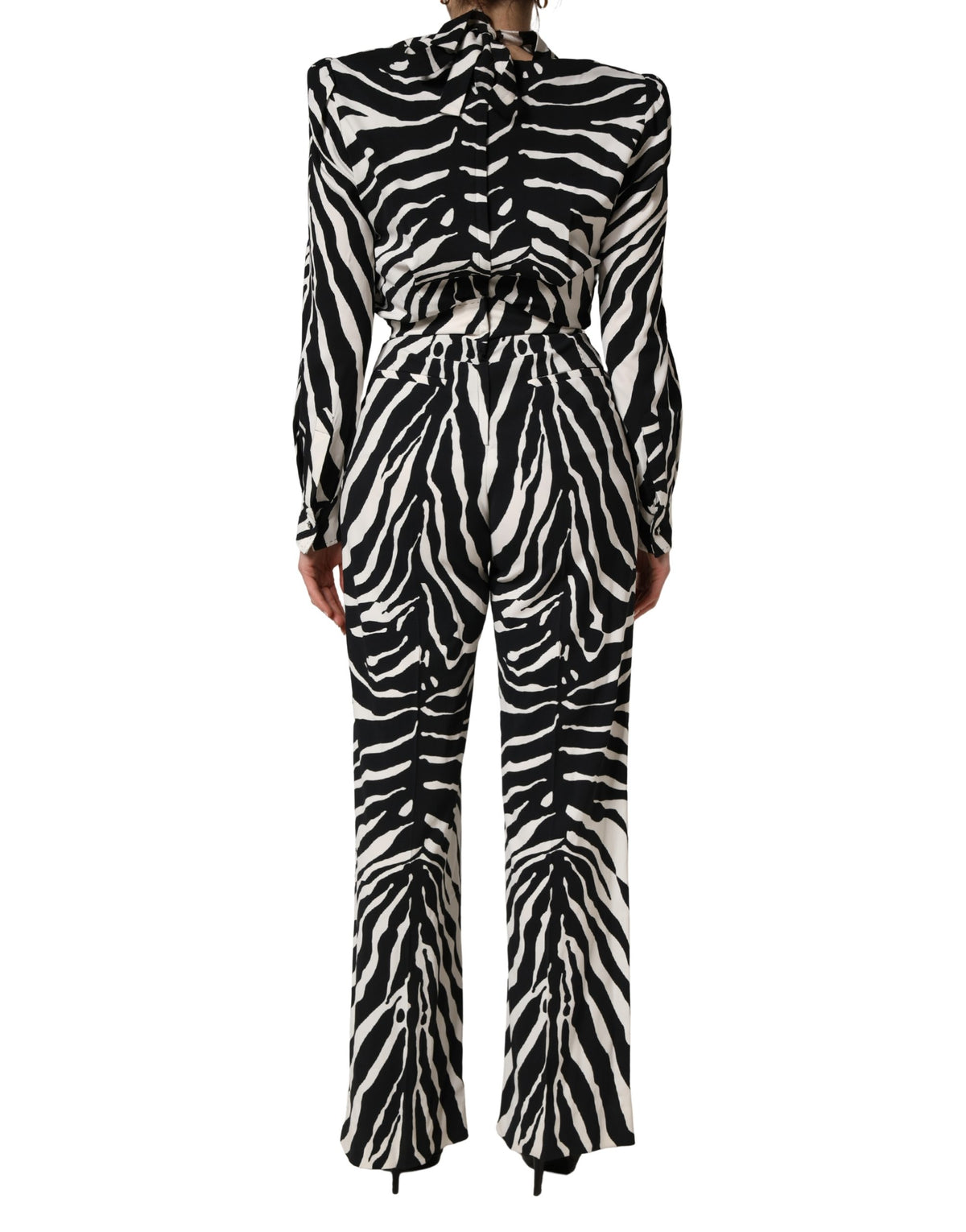 Indulge in the exquisite Dolce & Gabbana Black White Viscose Zebra Pattern Jumpsuit, a masterpiece of luxurious craftsmanship that elevates your style with bold sophistication.