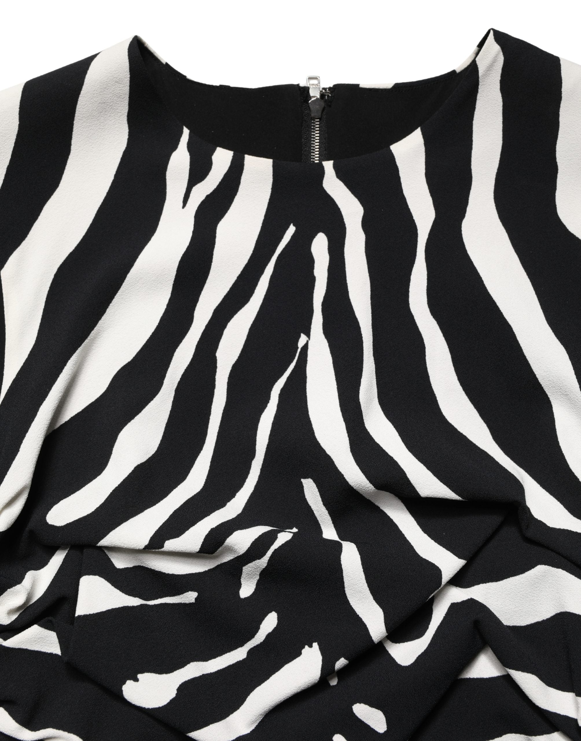 Indulge in the exquisite Dolce & Gabbana Black White Zebra Cady Calf Length Dress, a masterpiece of Italian craftsmanship that elevates your elegance and allure.