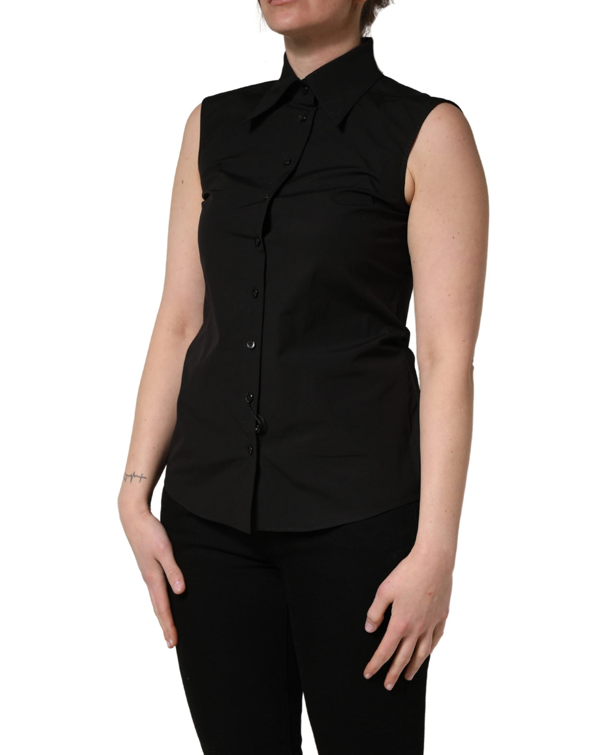 Indulge in the exquisite elegance of the Dolce & Gabbana Black Cotton Sleeveless Collared Blouse, a masterpiece of Italian craftsmanship that elevates your wardrobe with timeless sophistication.