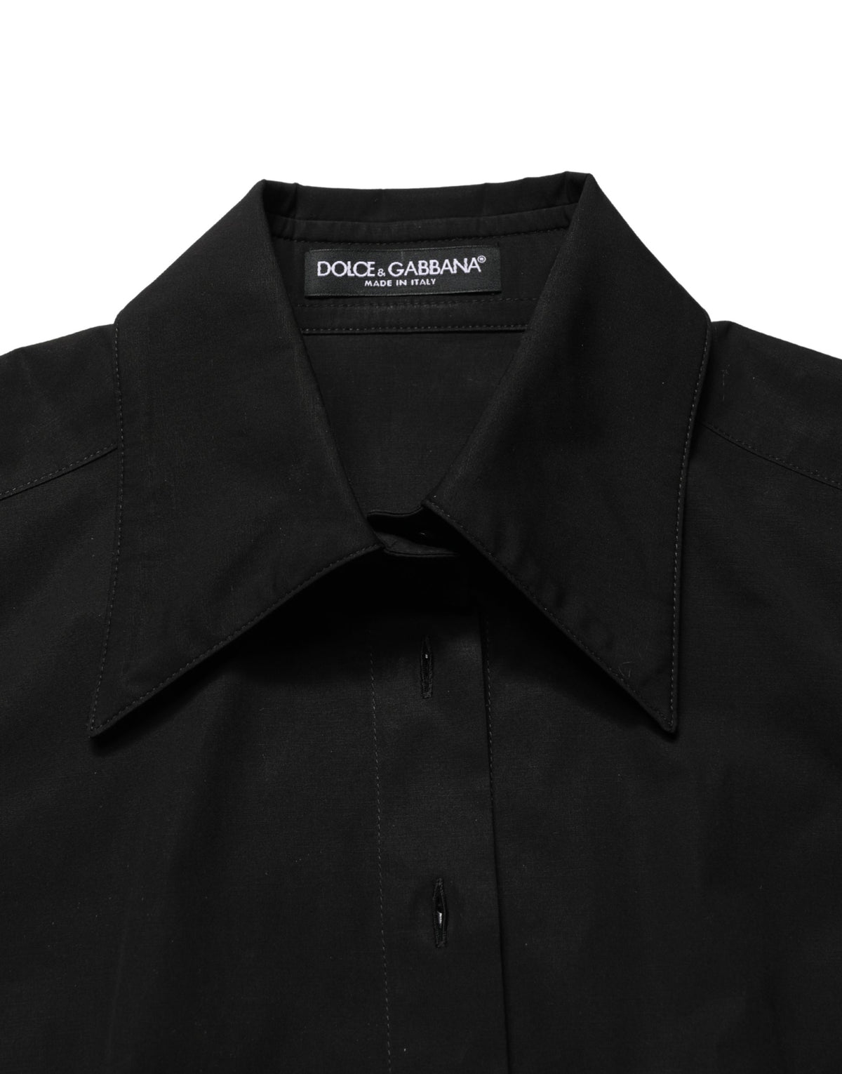 Indulge in the exquisite elegance of the Dolce & Gabbana Black Cotton Sleeveless Collared Blouse, a timeless piece that embodies luxury and Italian craftsmanship for the discerning individual.