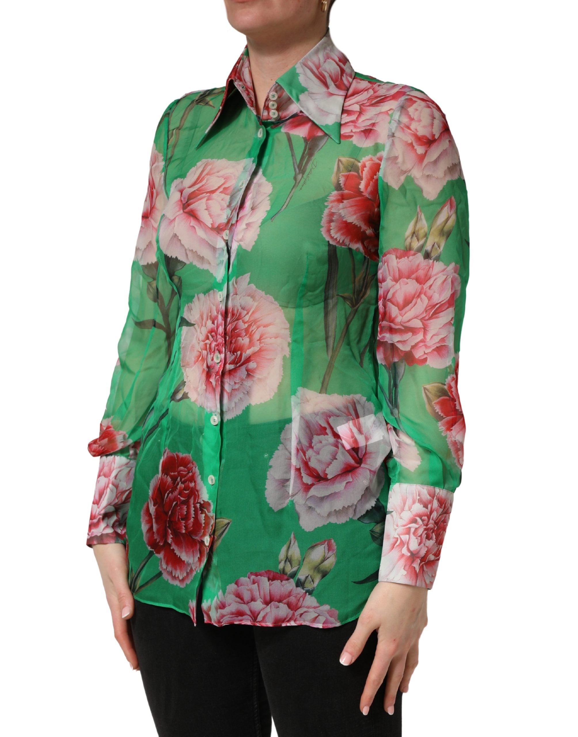 Indulge in the exquisite Dolce & Gabbana Green Carnation Print Silk Blouse, a masterpiece of Italian craftsmanship that embodies timeless elegance and sophistication.