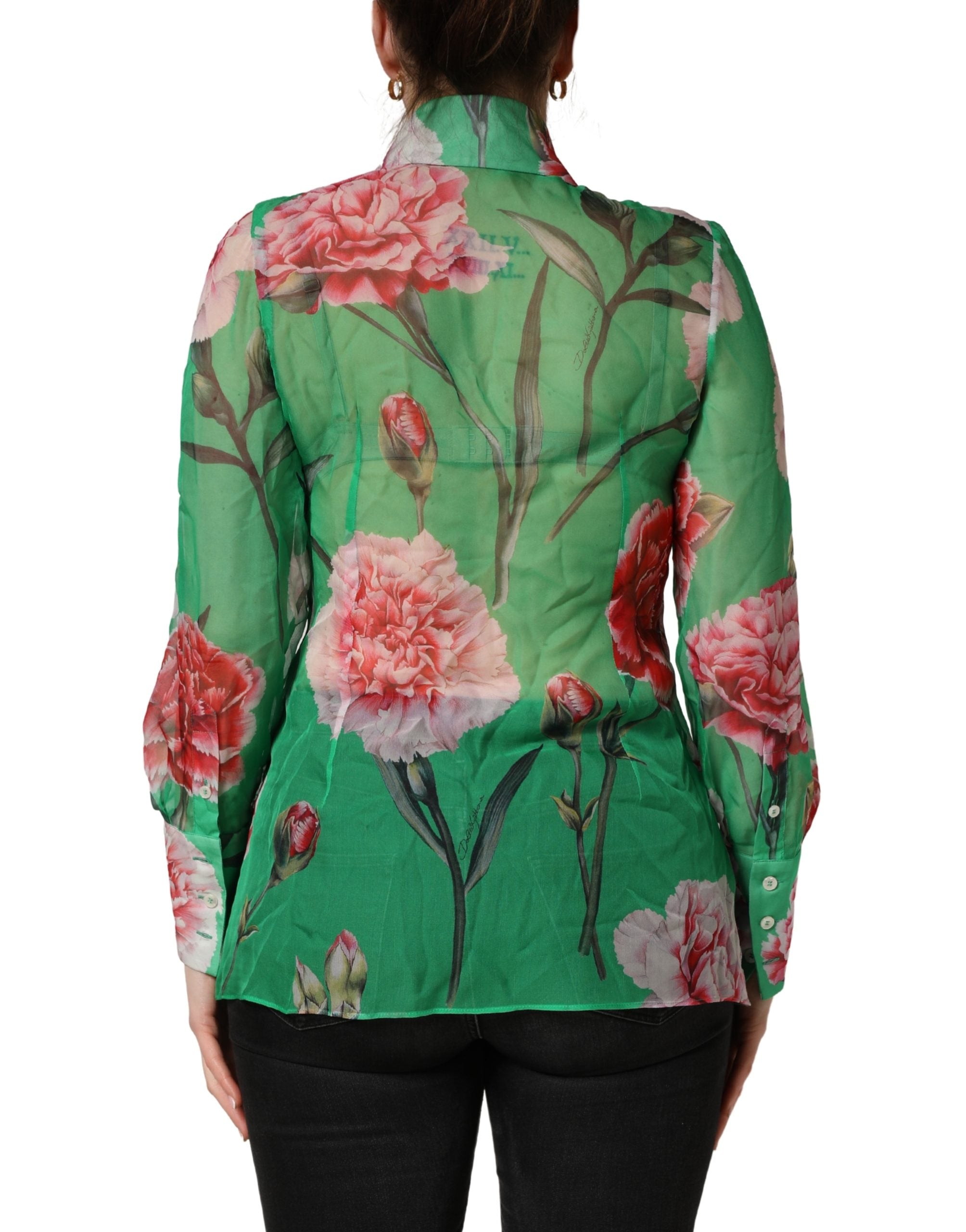 Indulge in the exquisite Dolce & Gabbana Green Carnation Print Silk Blouse, a masterpiece of Italian craftsmanship that embodies timeless elegance and sophisticated allure.