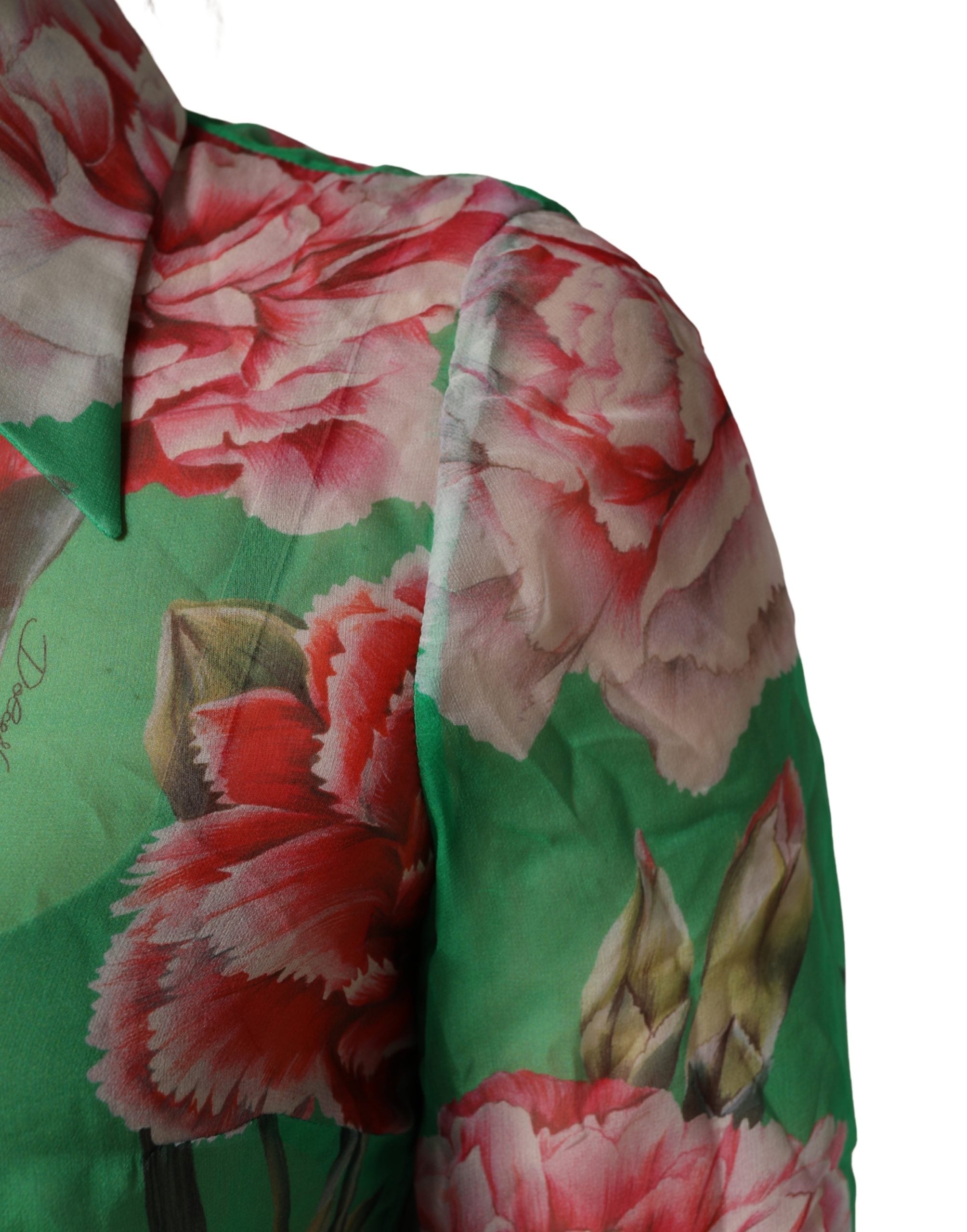 Indulge in the exquisite Dolce & Gabbana Green Carnation Print Silk Blouse, a masterpiece of Italian craftsmanship that embodies timeless elegance and sophisticated allure.