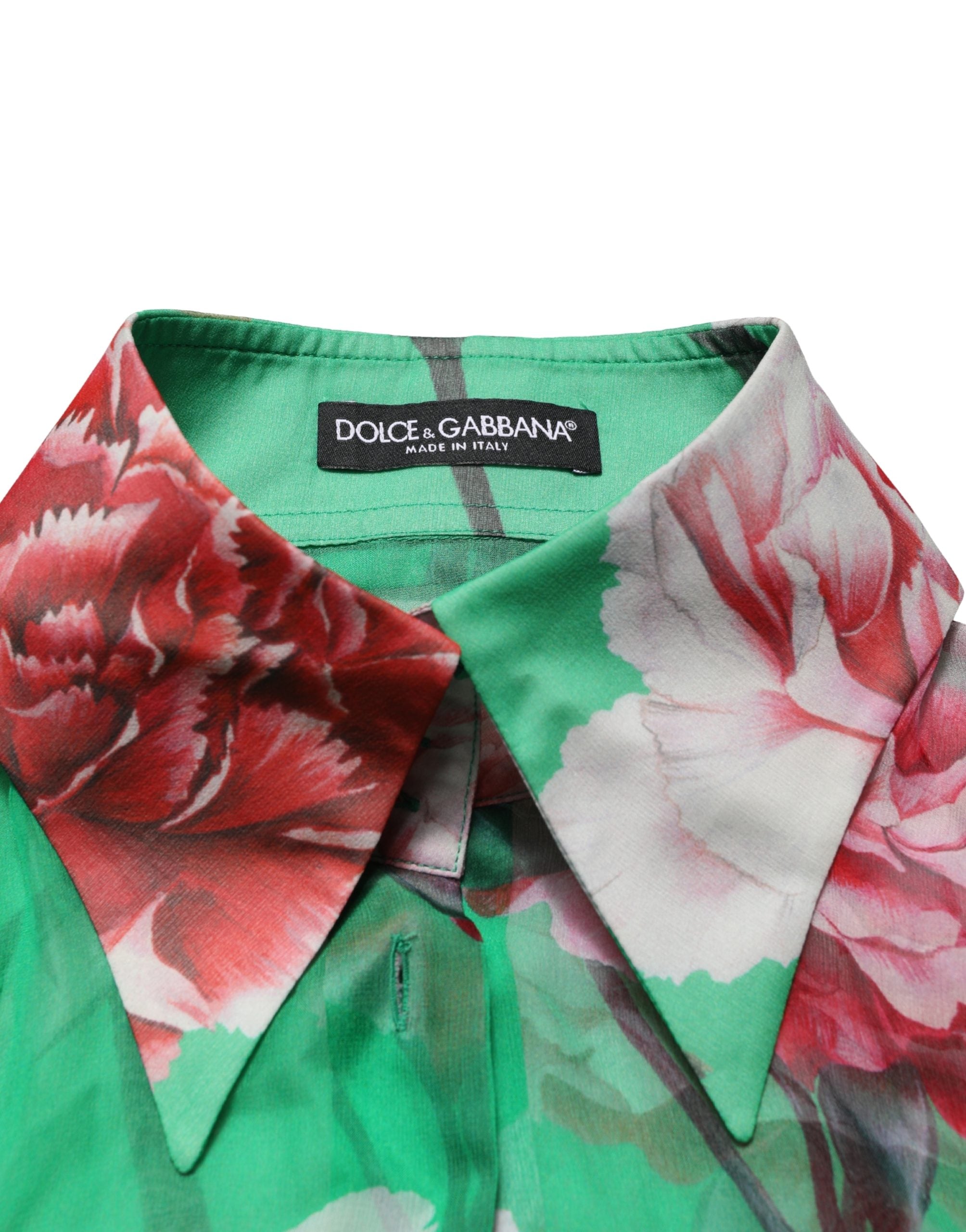 Indulge in the exquisite Dolce & Gabbana Green Carnation Print Silk Blouse, a masterpiece of Italian craftsmanship that embodies timeless elegance and sophisticated allure.