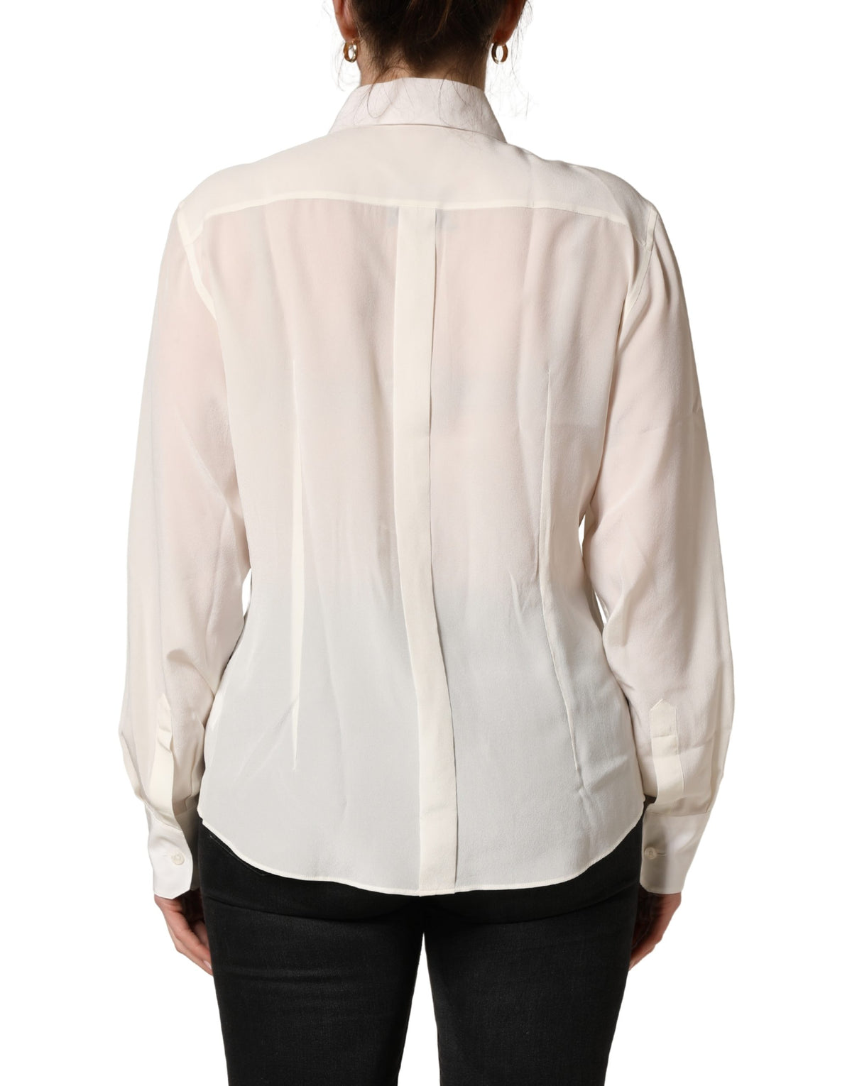 Indulge in the exquisite allure of the Dolce & Gabbana Off White Collared Long Sleeves Blouse, a silk masterpiece that embodies timeless elegance and refined Italian craftsmanship.