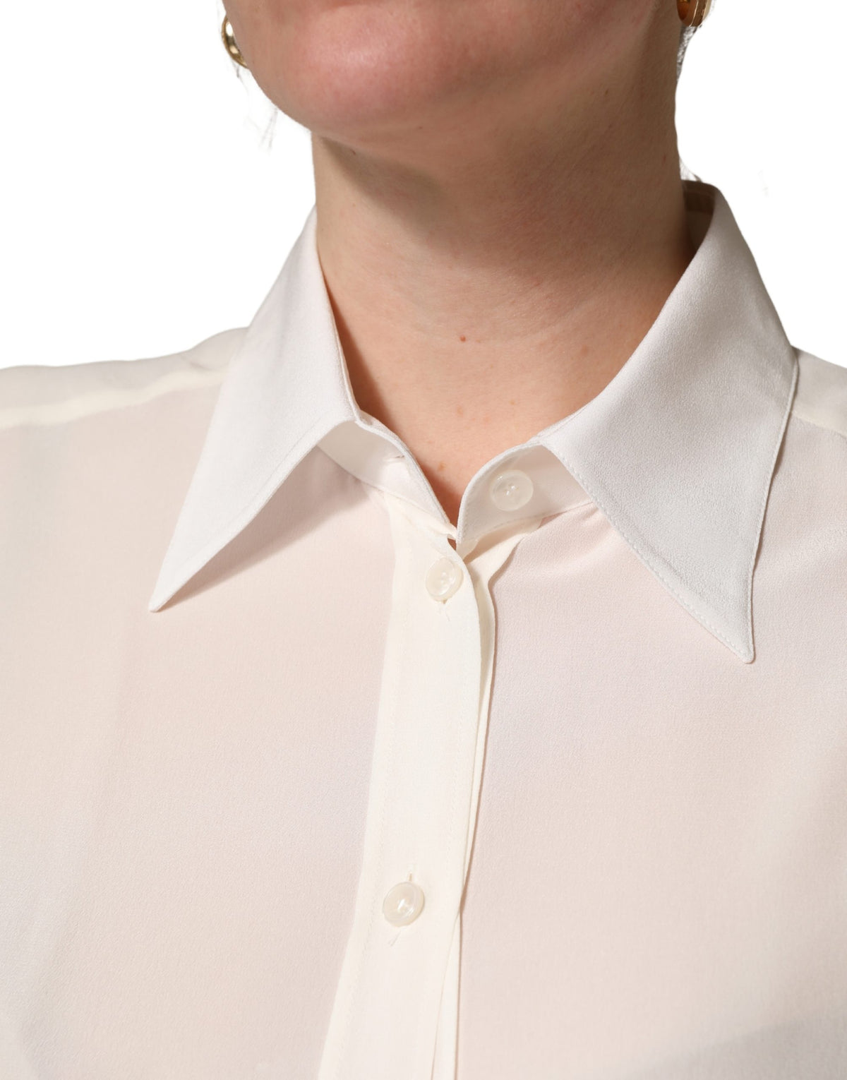 Indulge in the exquisite Dolce & Gabbana Off White Collared Long Sleeves Blouse, a silk masterpiece embodying timeless elegance and refined Italian craftsmanship.
