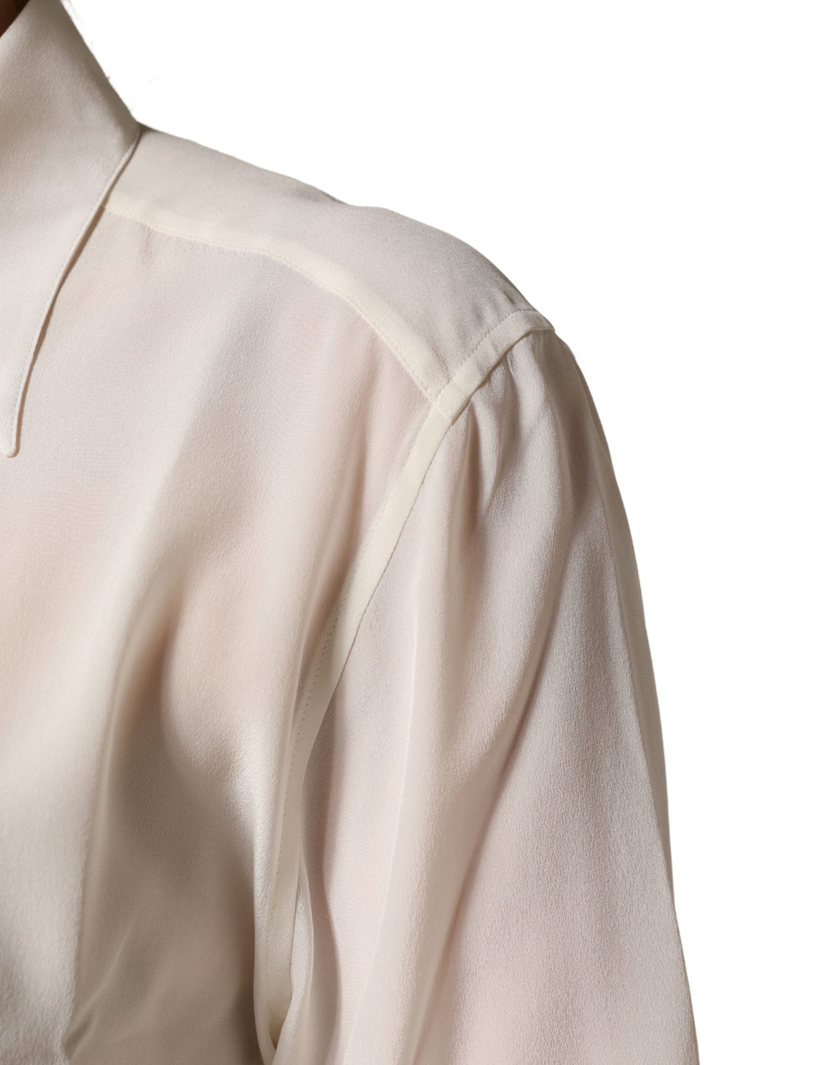 Experience the exquisite allure of the Dolce & Gabbana Off White Collared Long Sleeves Blouse, a timeless silk masterpiece that embodies elegance and sophistication.