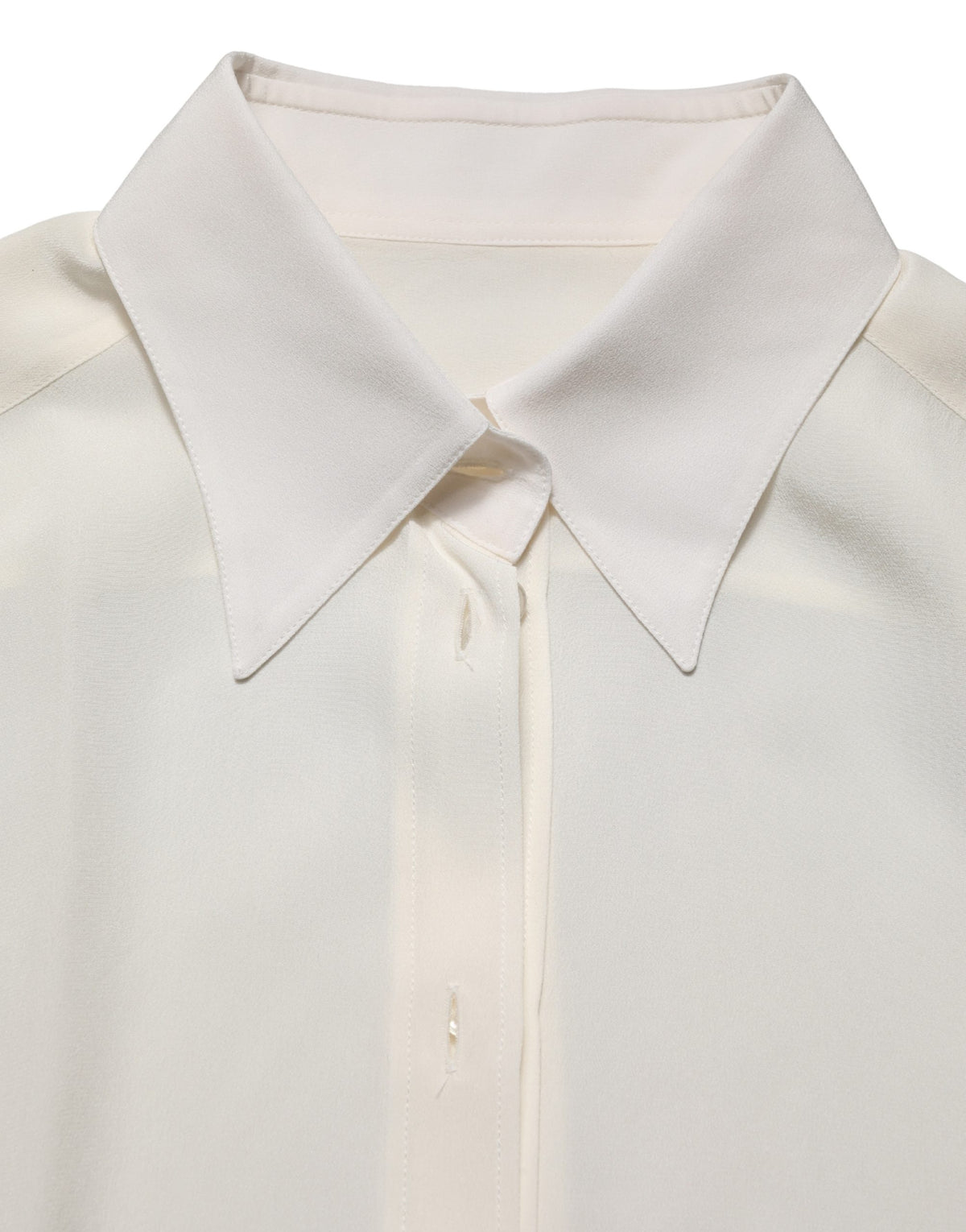 Experience the allure of the Dolce & Gabbana Off White Collared Long Sleeves Blouse, a silk masterpiece that embodies timeless elegance and exquisite Italian craftsmanship.