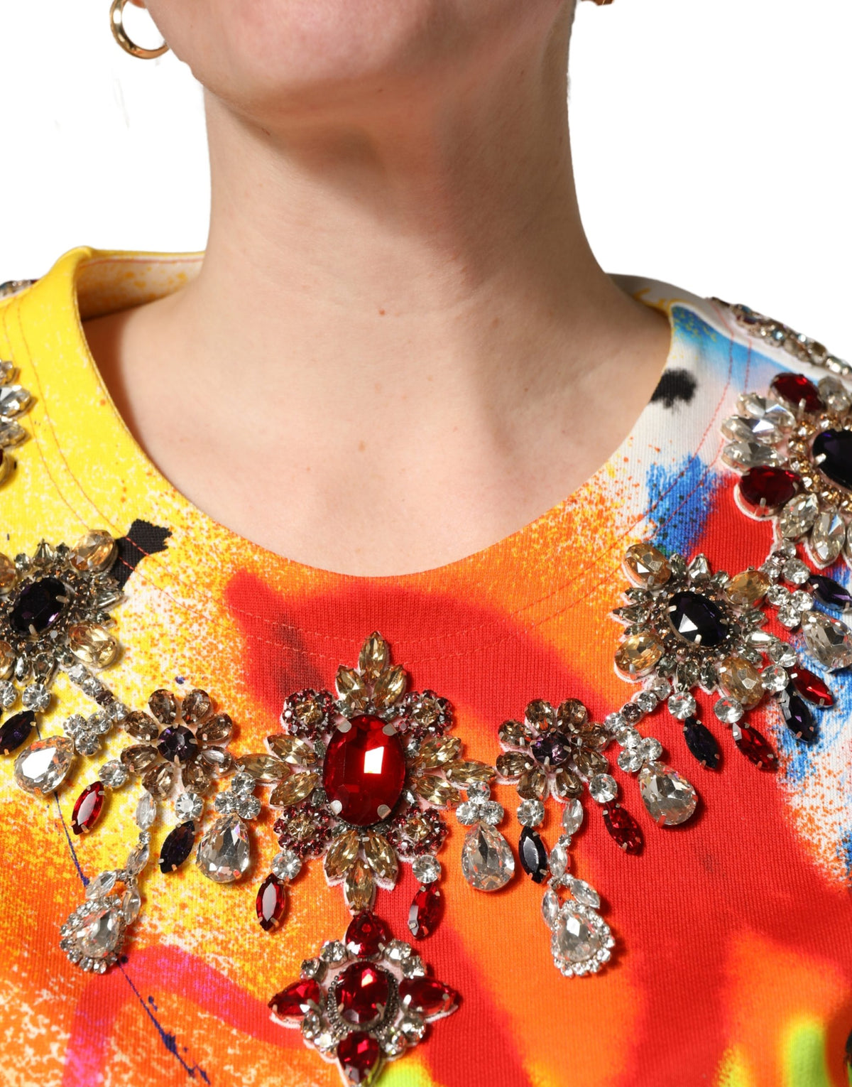 Indulge in the exquisite Dolce & Gabbana Multicolor Graffiti Crystals Crop Jersey Top, a masterpiece of Italian craftsmanship, perfect for elevating any sophisticated ensemble.