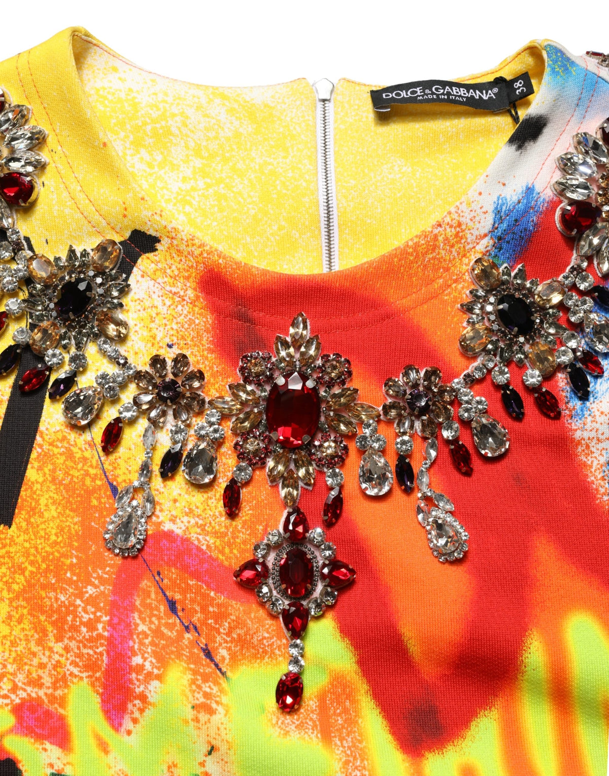 Indulge in the exquisite Dolce & Gabbana Multicolor Graffiti Crystals Crop Jersey Top, a masterpiece of Italian craftsmanship, perfect for elevating your summer soirées with luxurious allure.