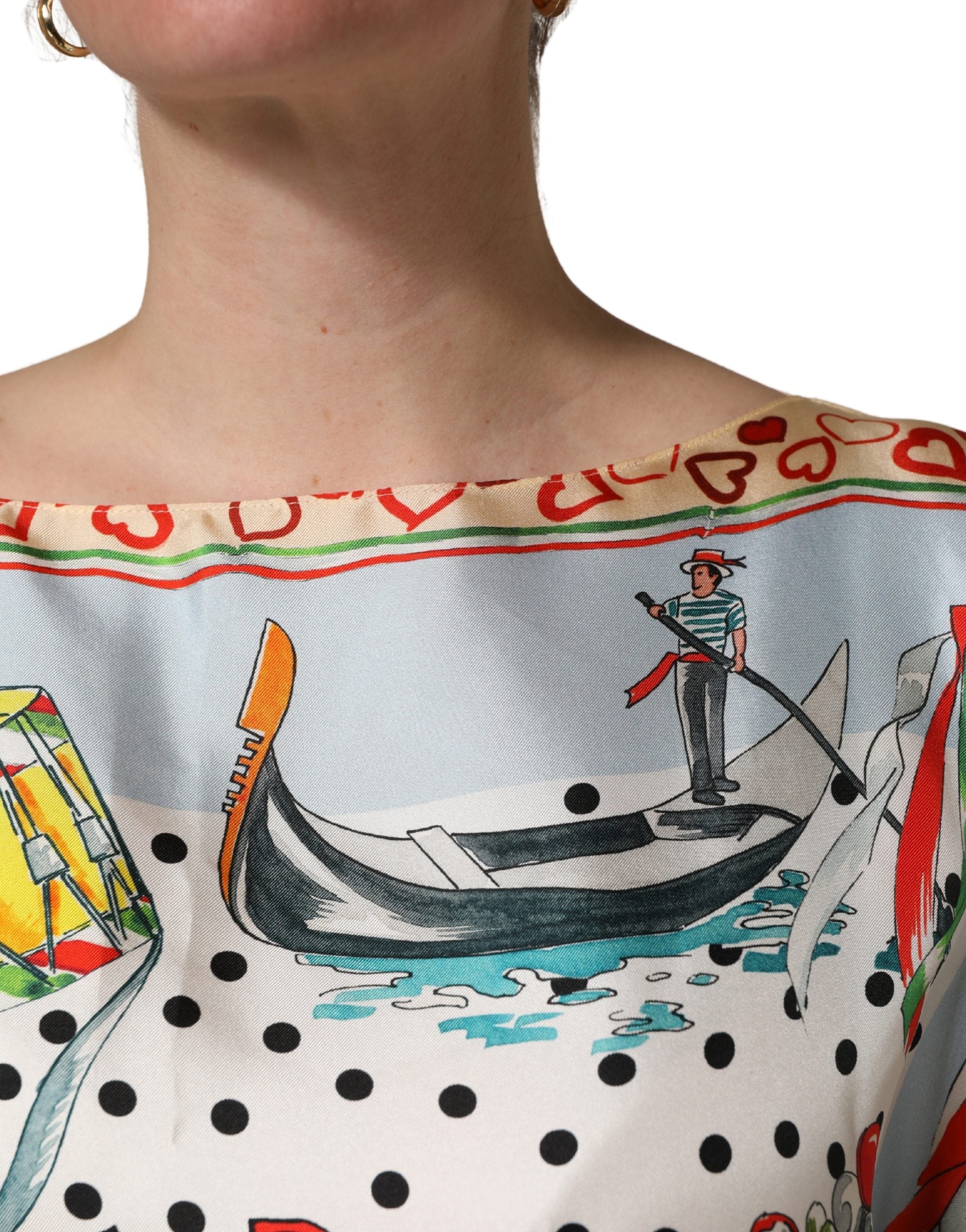 Elevate your wardrobe with the Dolce & Gabbana Multicolor Italy Scenes Graphic Silk Top, a masterpiece of Italian craftsmanship that embodies luxury and artistic allure.