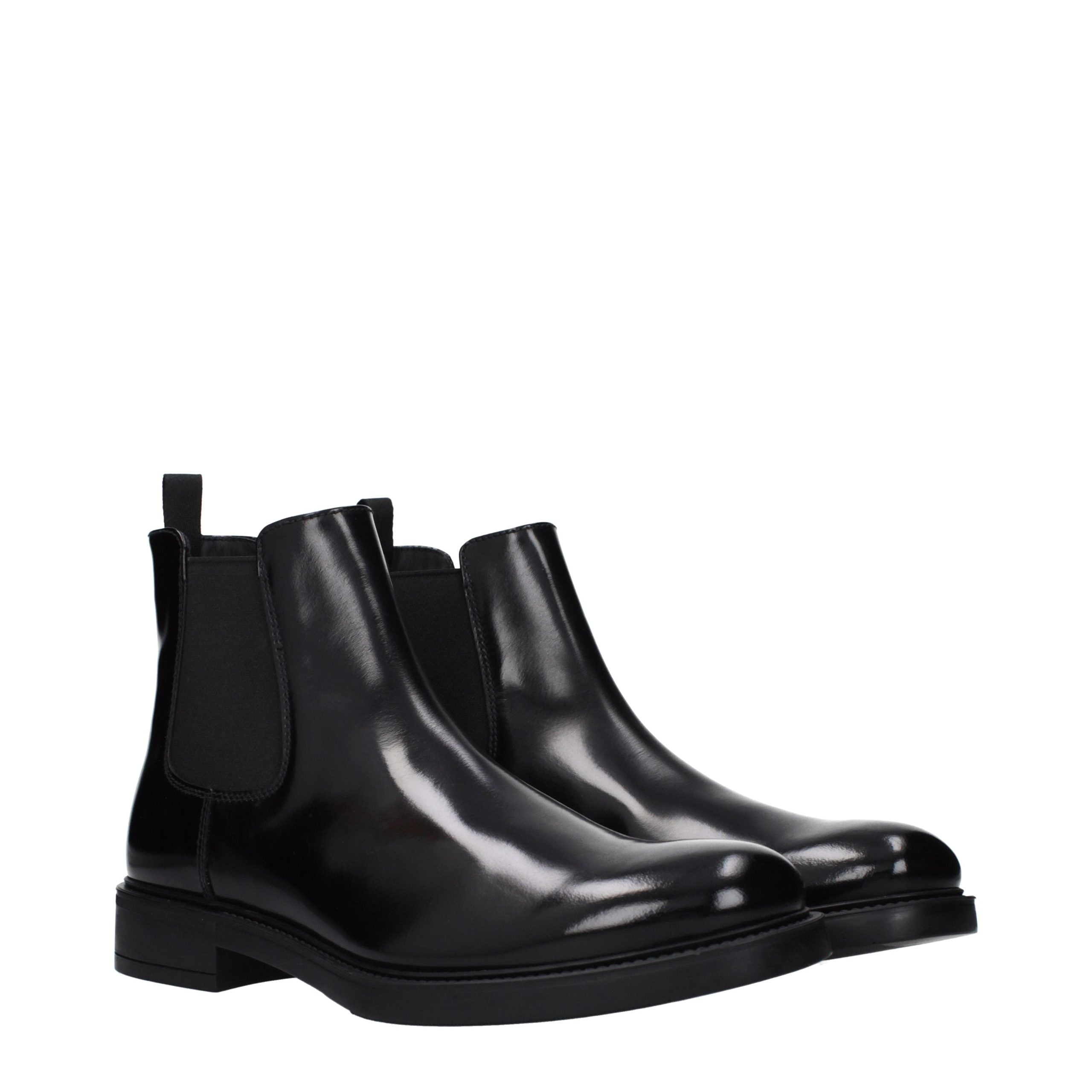 Experience the exquisite elegance of Prada Black Leather Ankle Boots, a masterpiece of Italian craftsmanship that elevates your style with luxurious versatility.