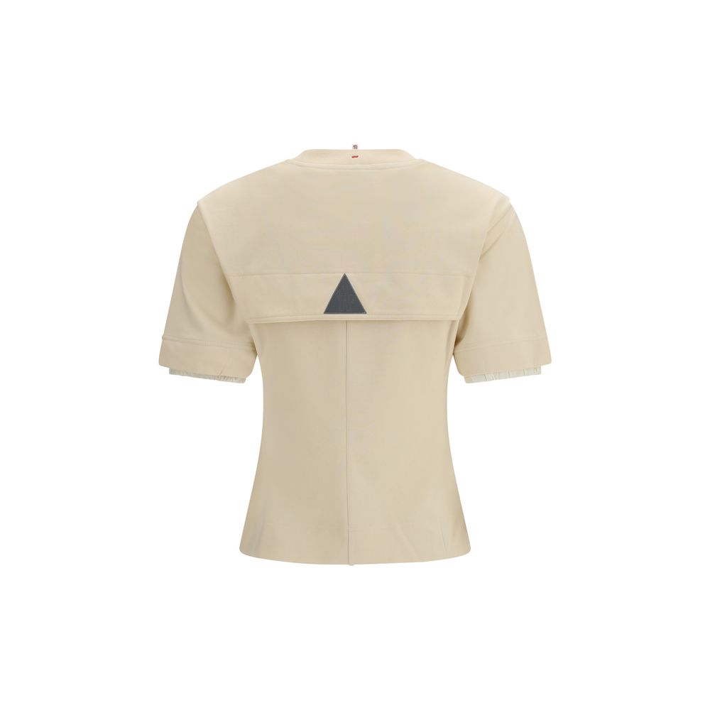 Elevate your style with the Moncler Grenoble Beige Cotton T-Shirt, crafted from luxurious cotton for unmatched comfort and timeless elegance in every occasion.